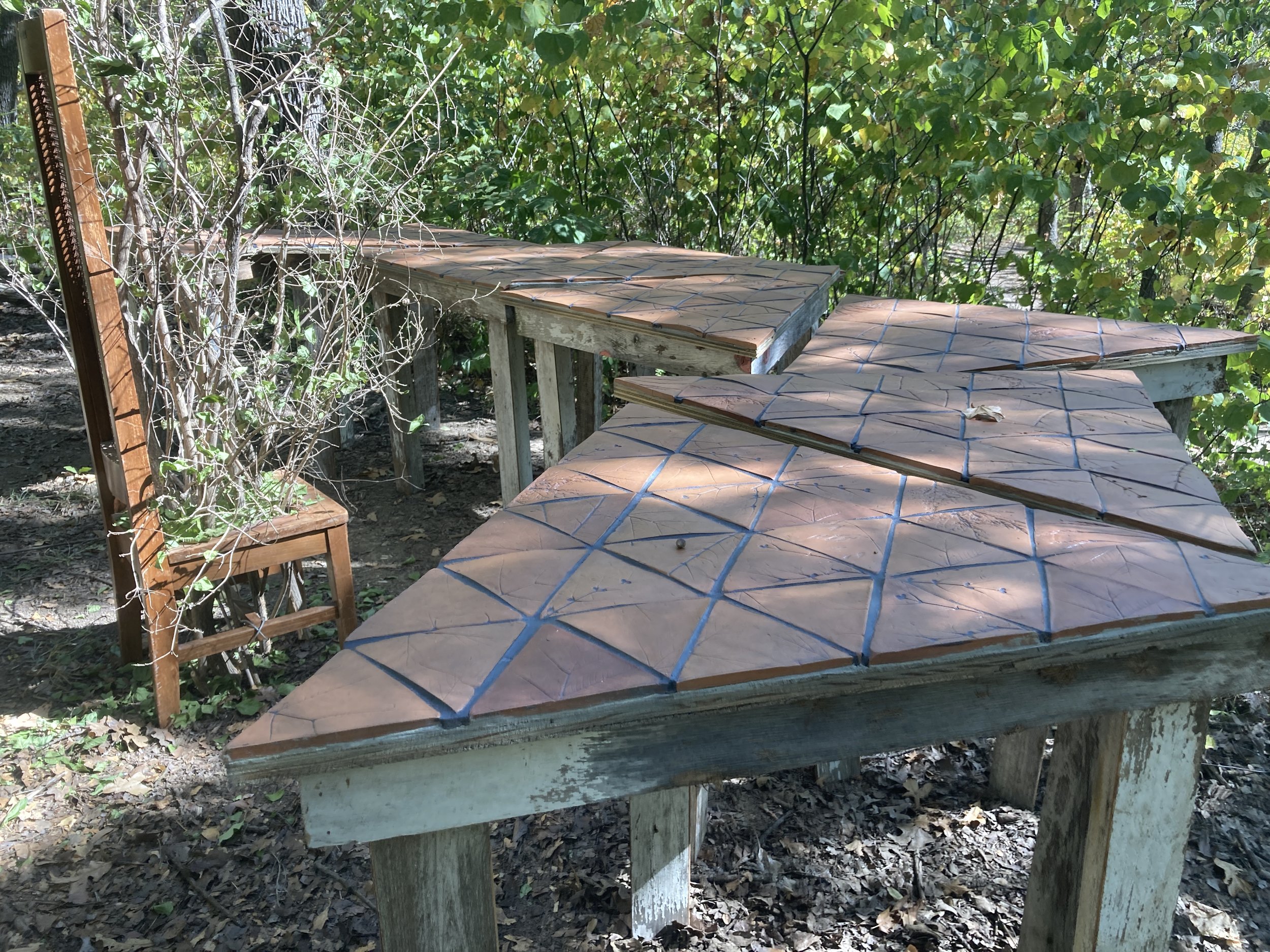 A seat at the table
2022
72” x 96” x 50”
Locally sourced clay, aged wood, found chair, honeysuckle branches
