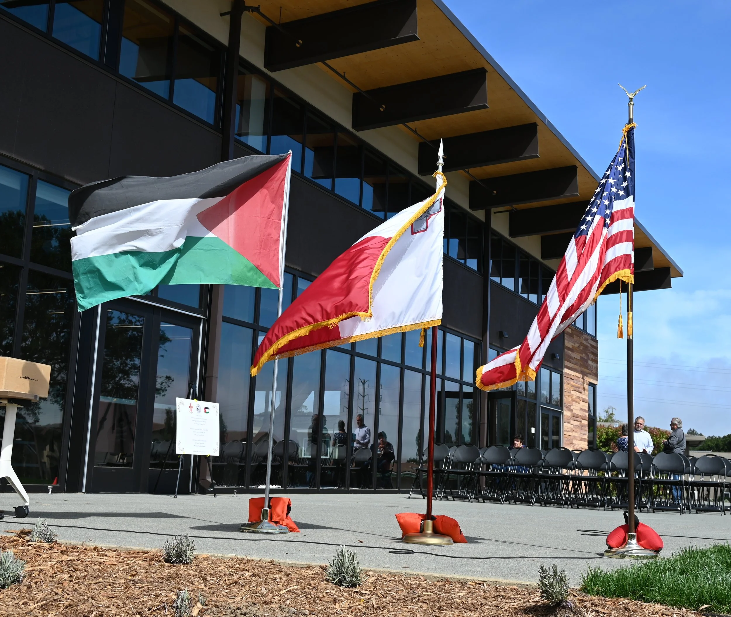 Left to Right Palestinian Flag, Maltese (Malta) Flag, United States Flag