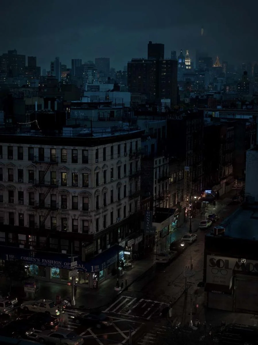 The corner of Orchard and Delancy Streets, NYC, at Night, in rain and fog.