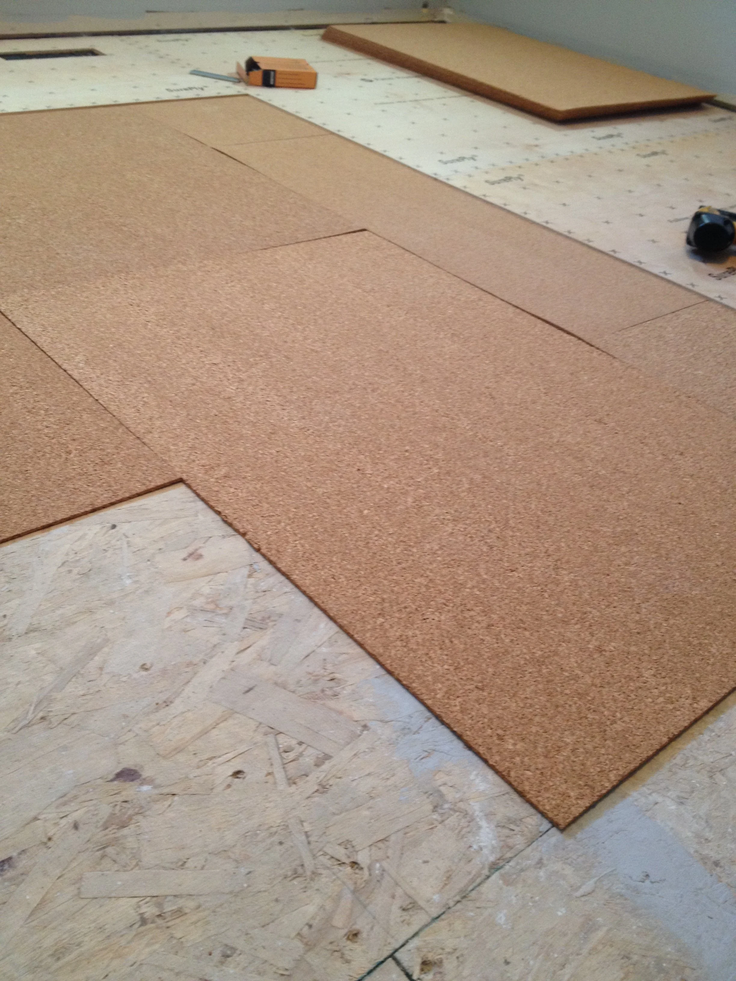 Cork underlayment sheets installed over a subfloor