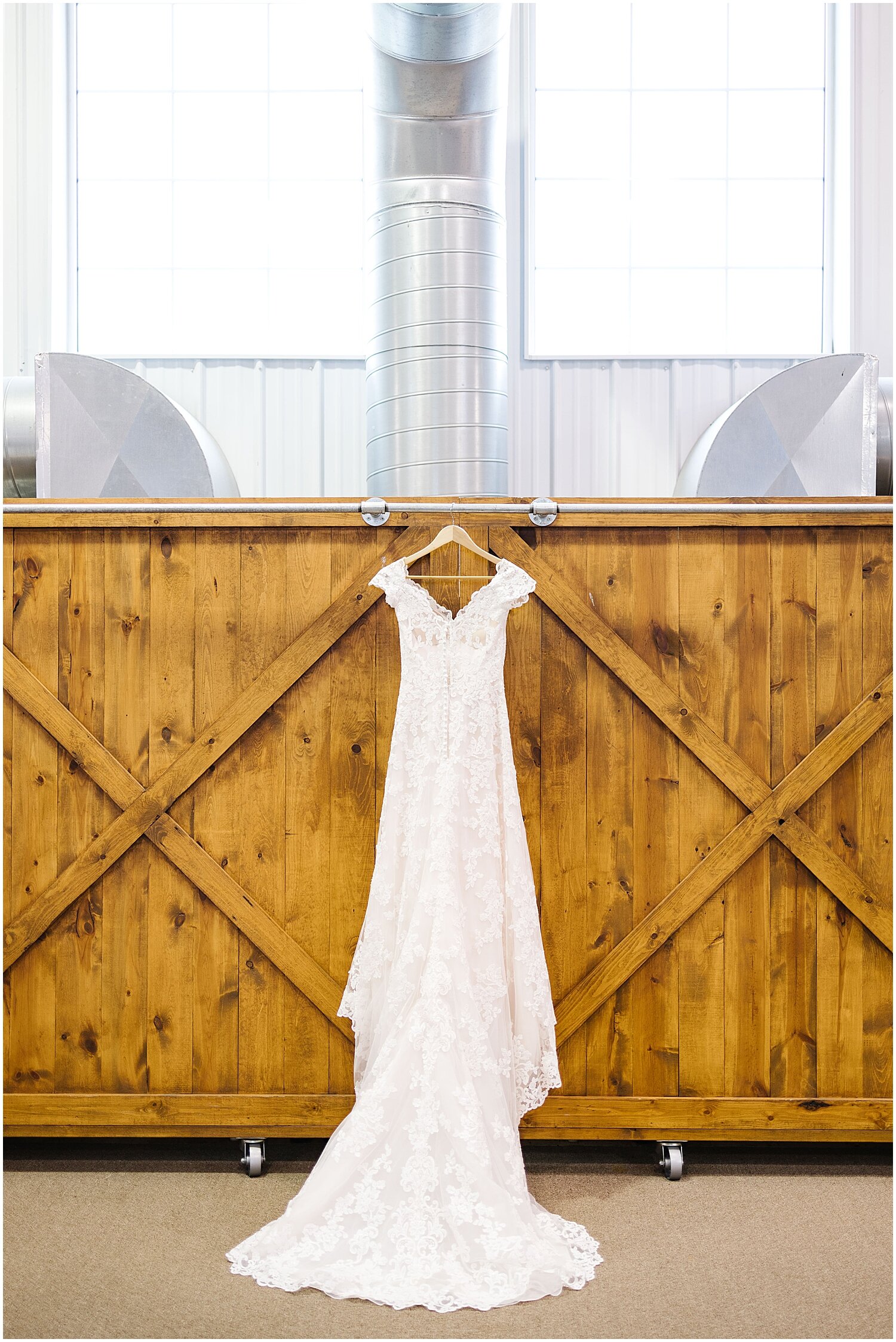  bride’s wedding dress hanging before the wedding 