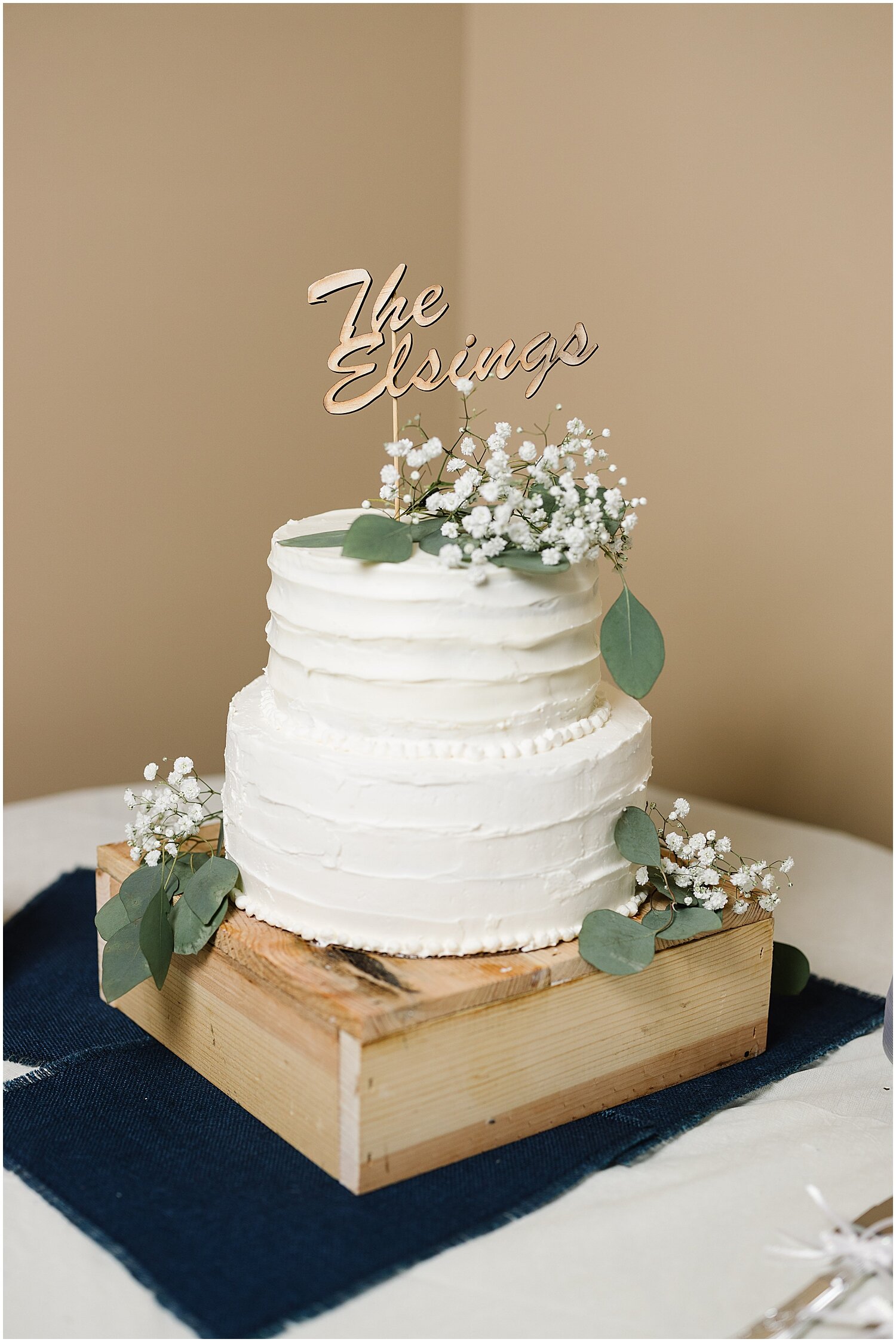  white and greenery wedding cake 