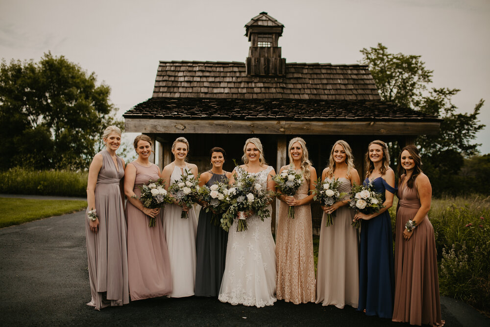  bride and bridesmaids holding their bridal bouquet 