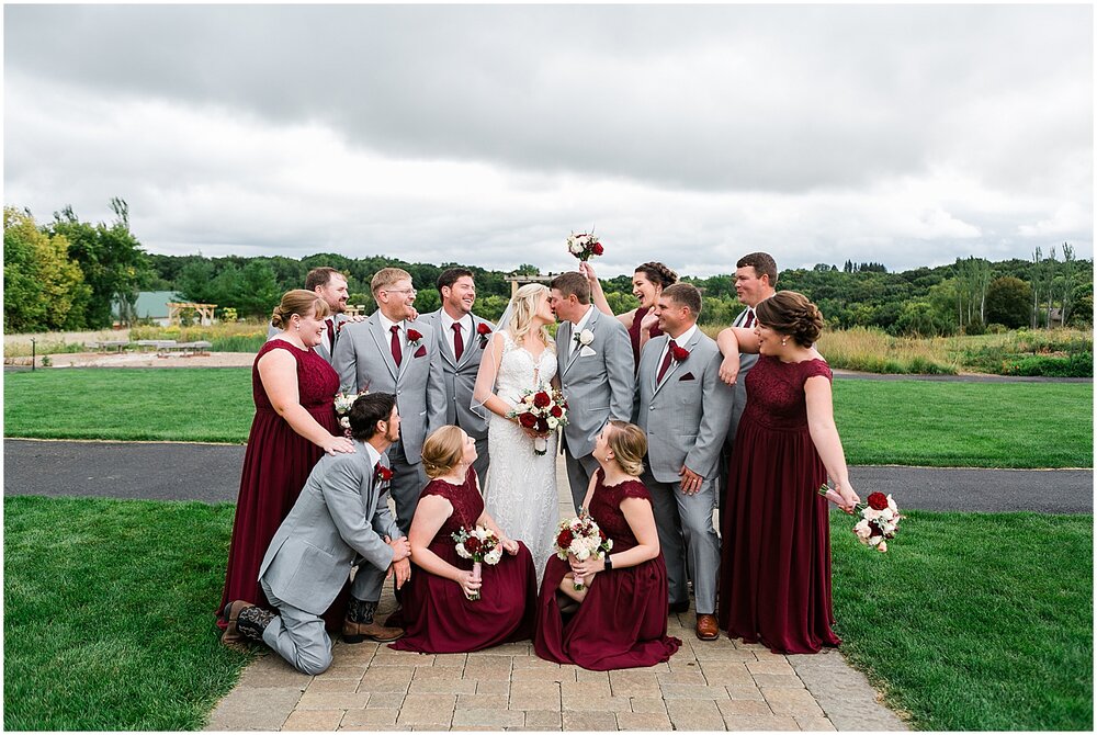  bride and groom with their wedding party 