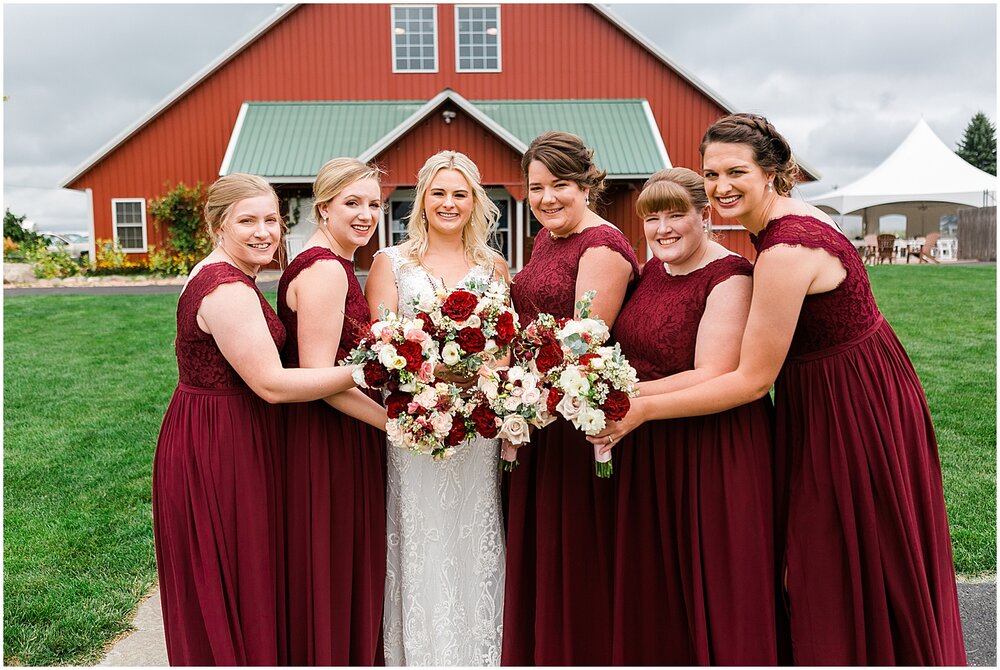  bride and bridesmaids holding their wedding bouquets 