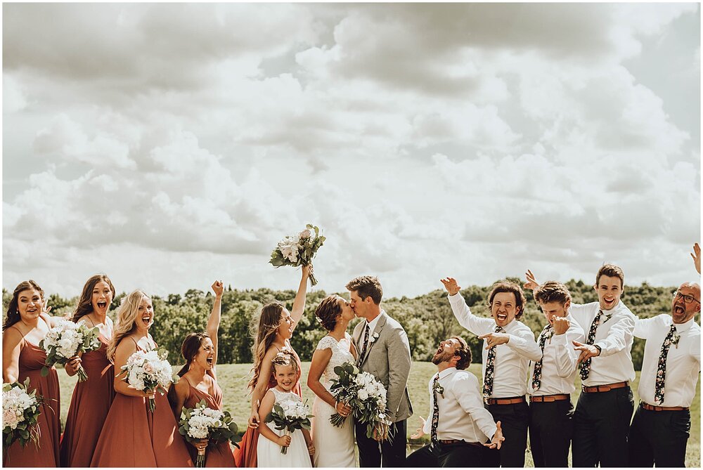  bride and groom with their wedding party 