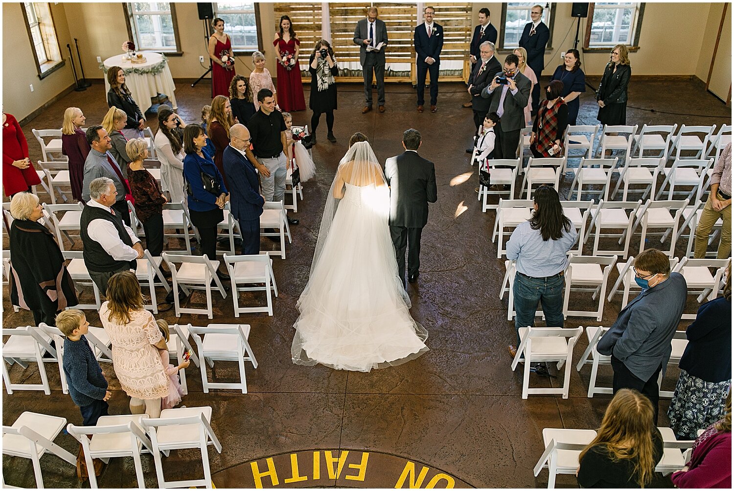  father and bride walking down the aisle 