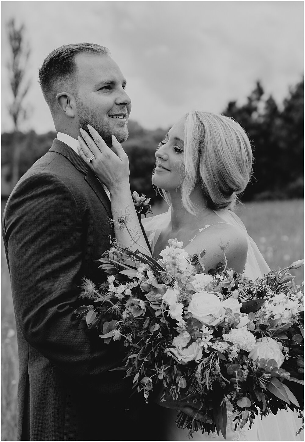  bride and groom smiling for their couple portraits 