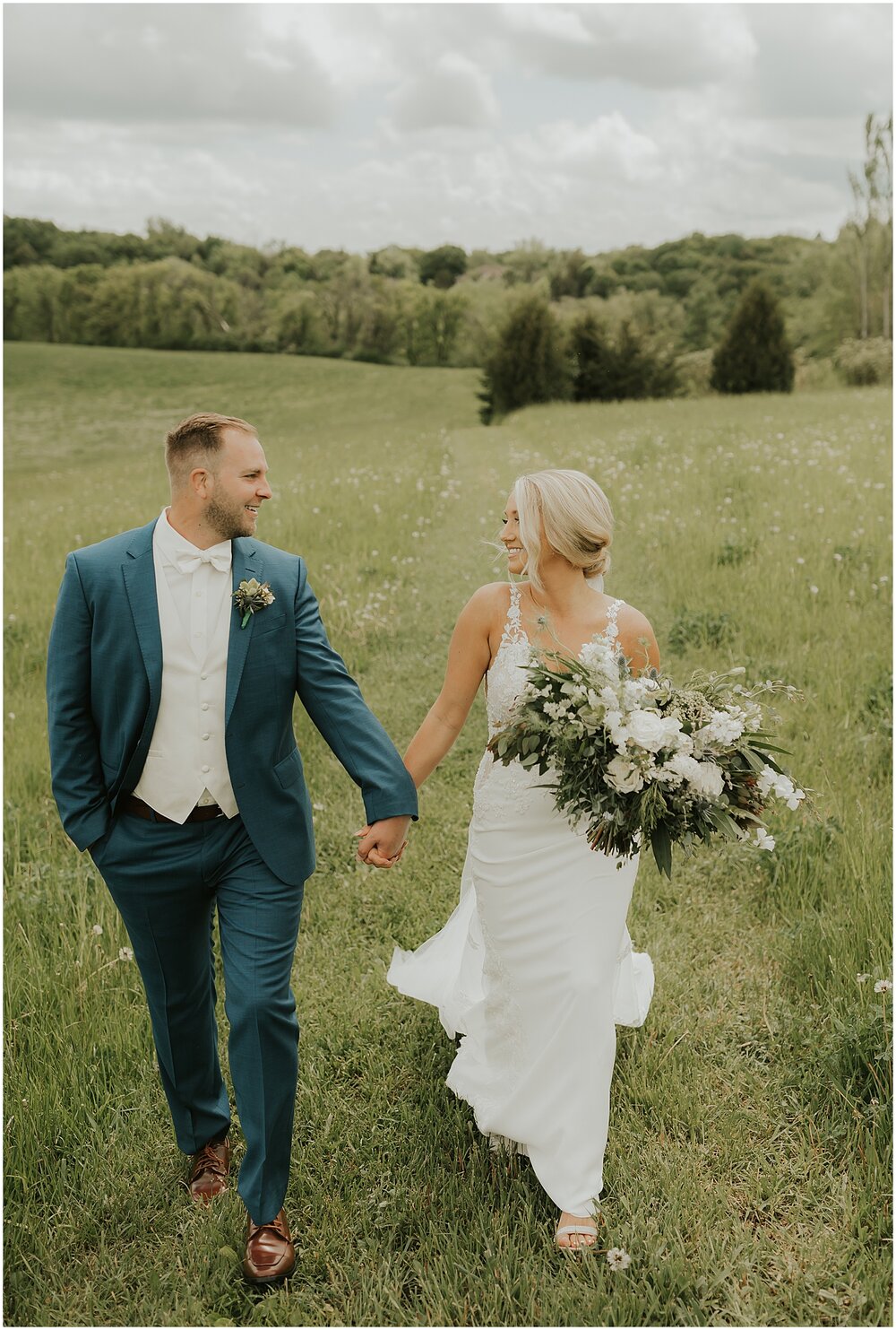  bride and groom holding hands during their first look 