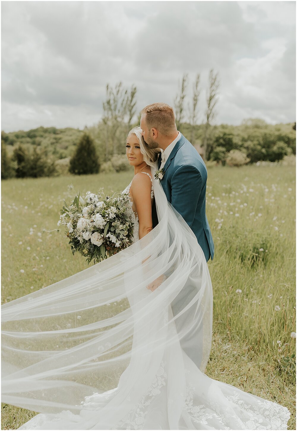  bride and groom portraits along the green fields at The Outpost Center 