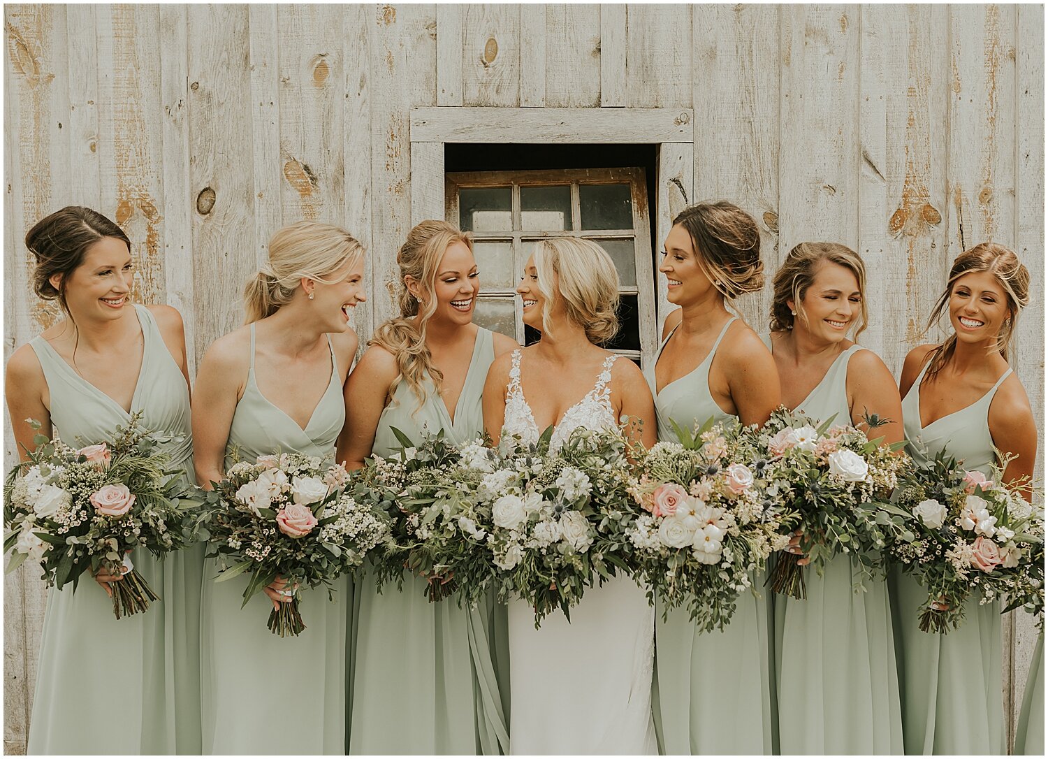  bride and bridesmaids holding their bridal bouquets 