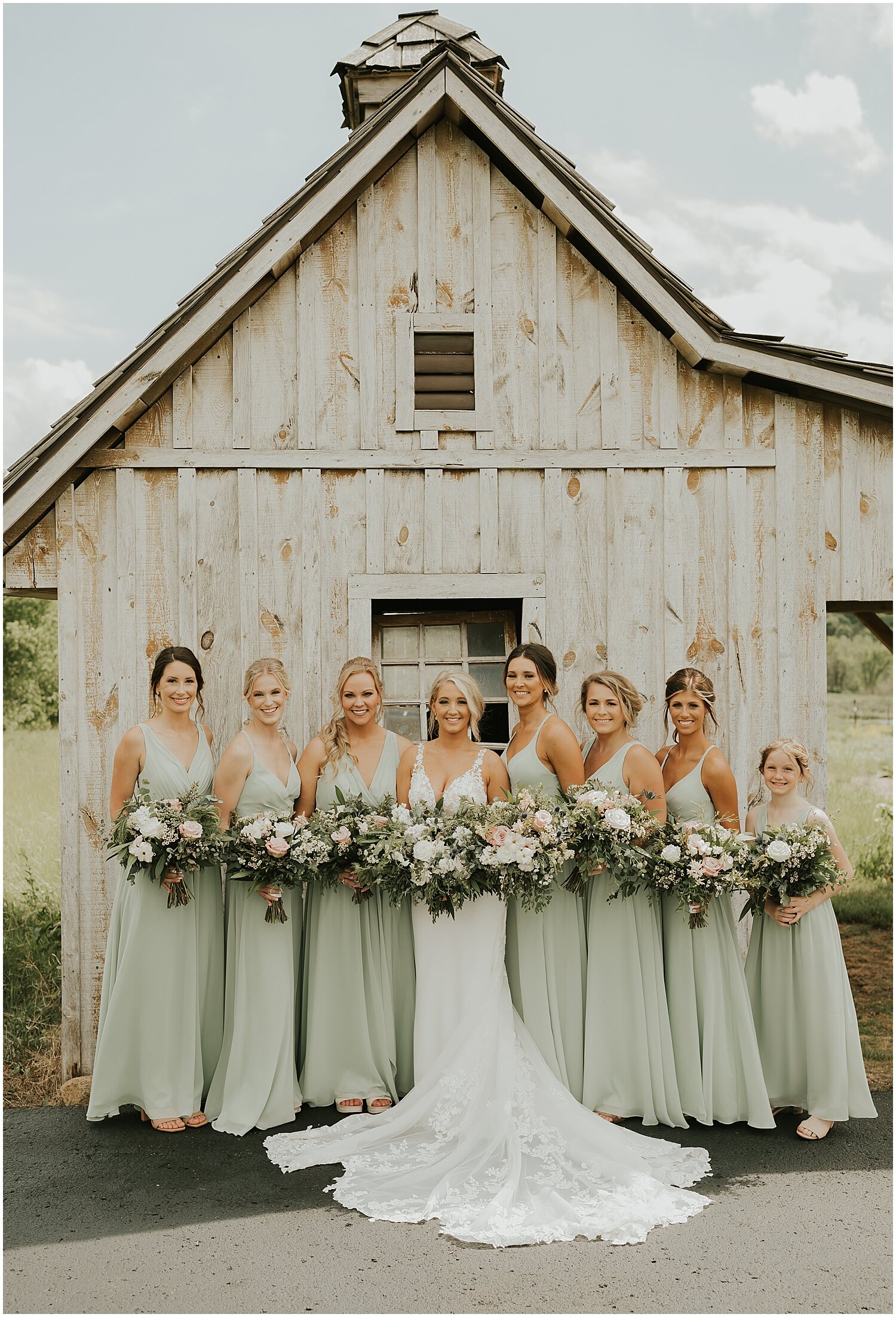  bride and bridesmaids holding their bridal bouquets 