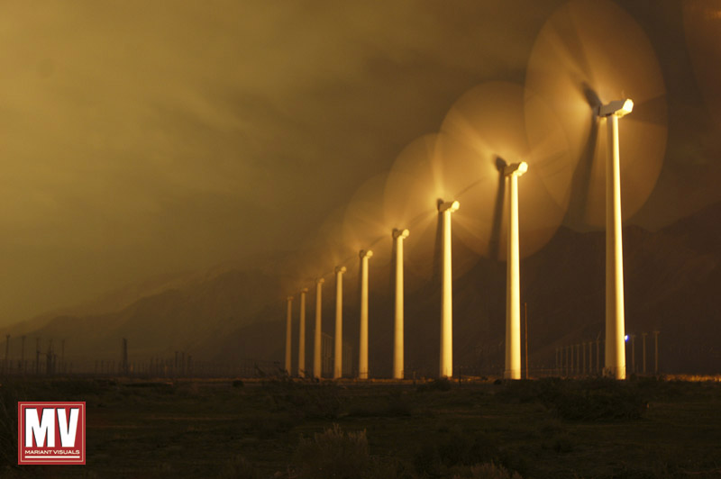 Illuminated by a electrical substation, a line of wind turbines spin as a powerful winter storm blows through the desert and the Palm Springs wind farm east of Los Angeles.