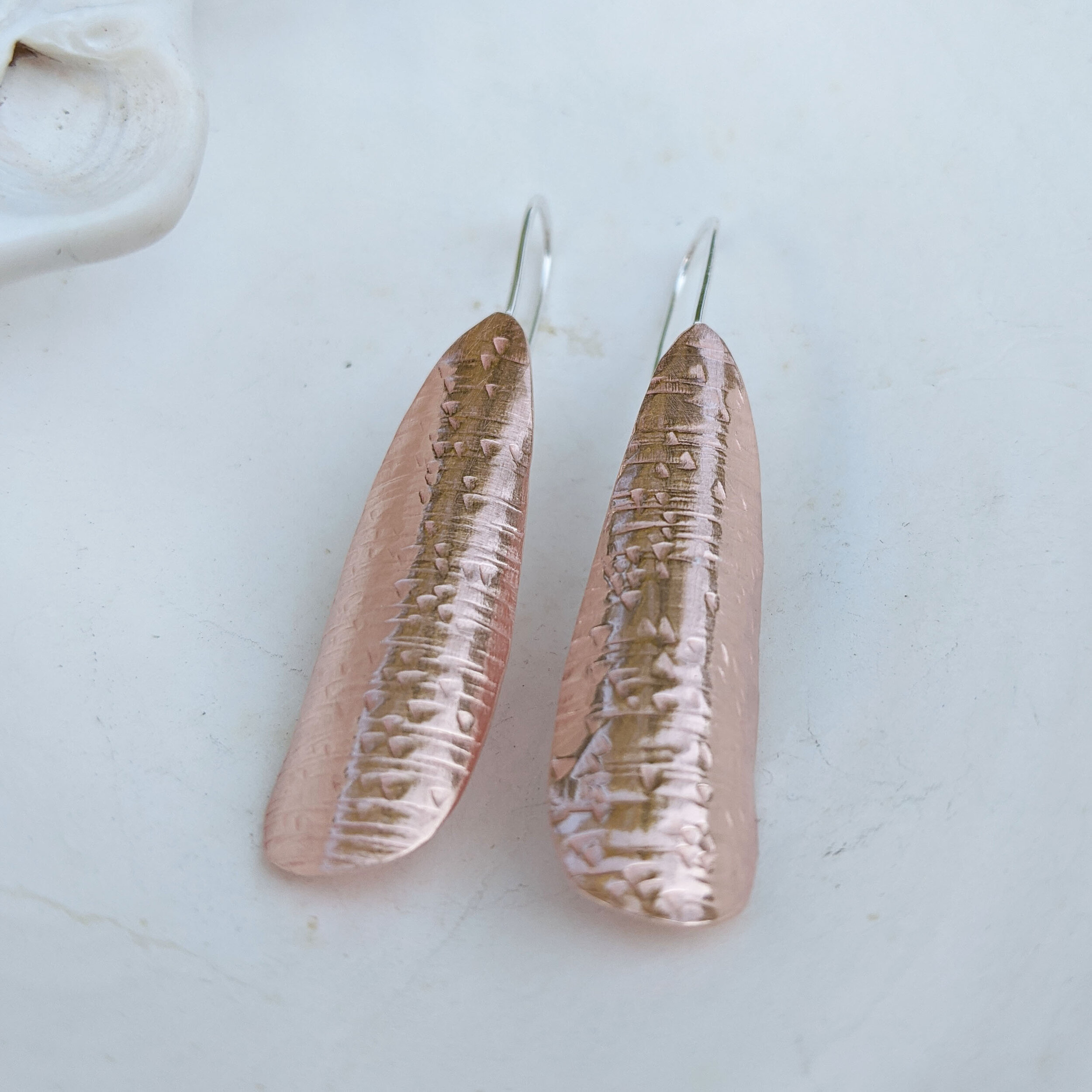 Textured organic drops with sterling ear wires.
