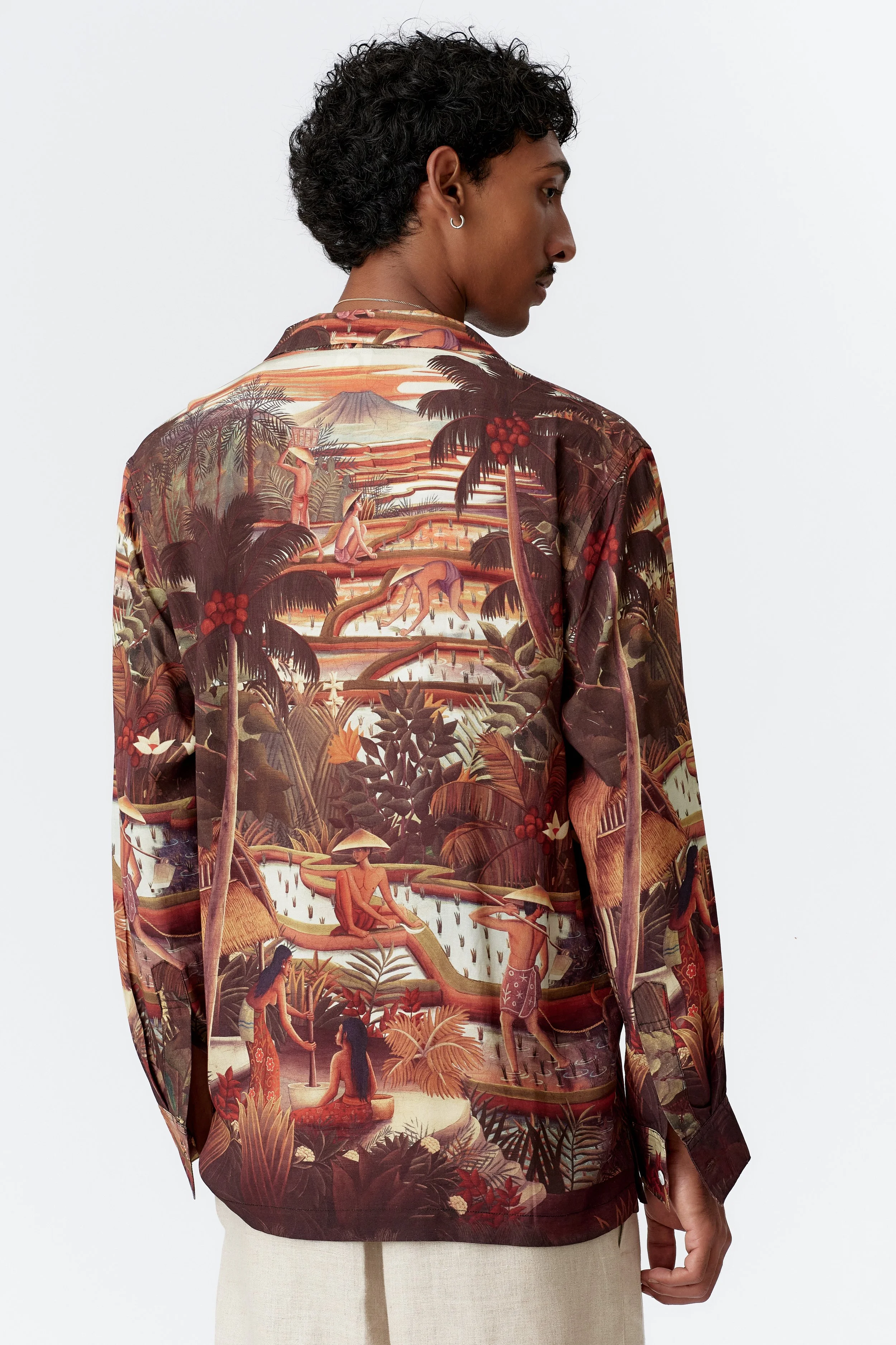 Back view of Subak brown long sleeve shirt featuring full landscape print