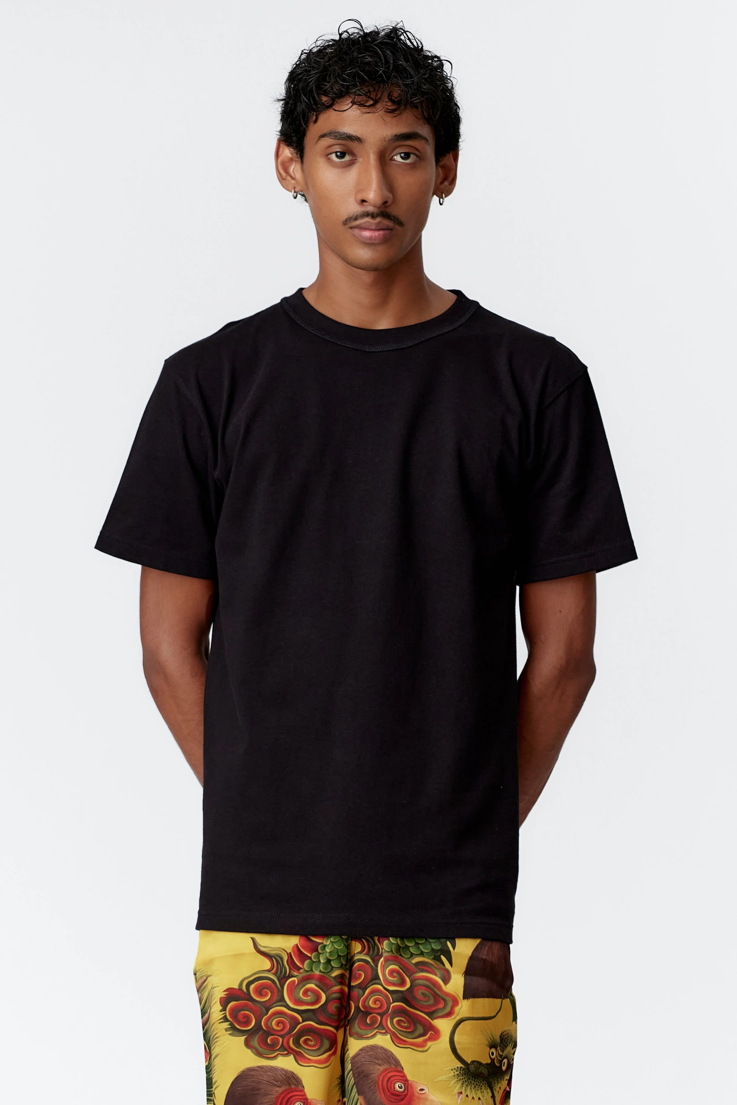 Relaxed fit Organic Cotton model wears tiger back print art t-shirt in black