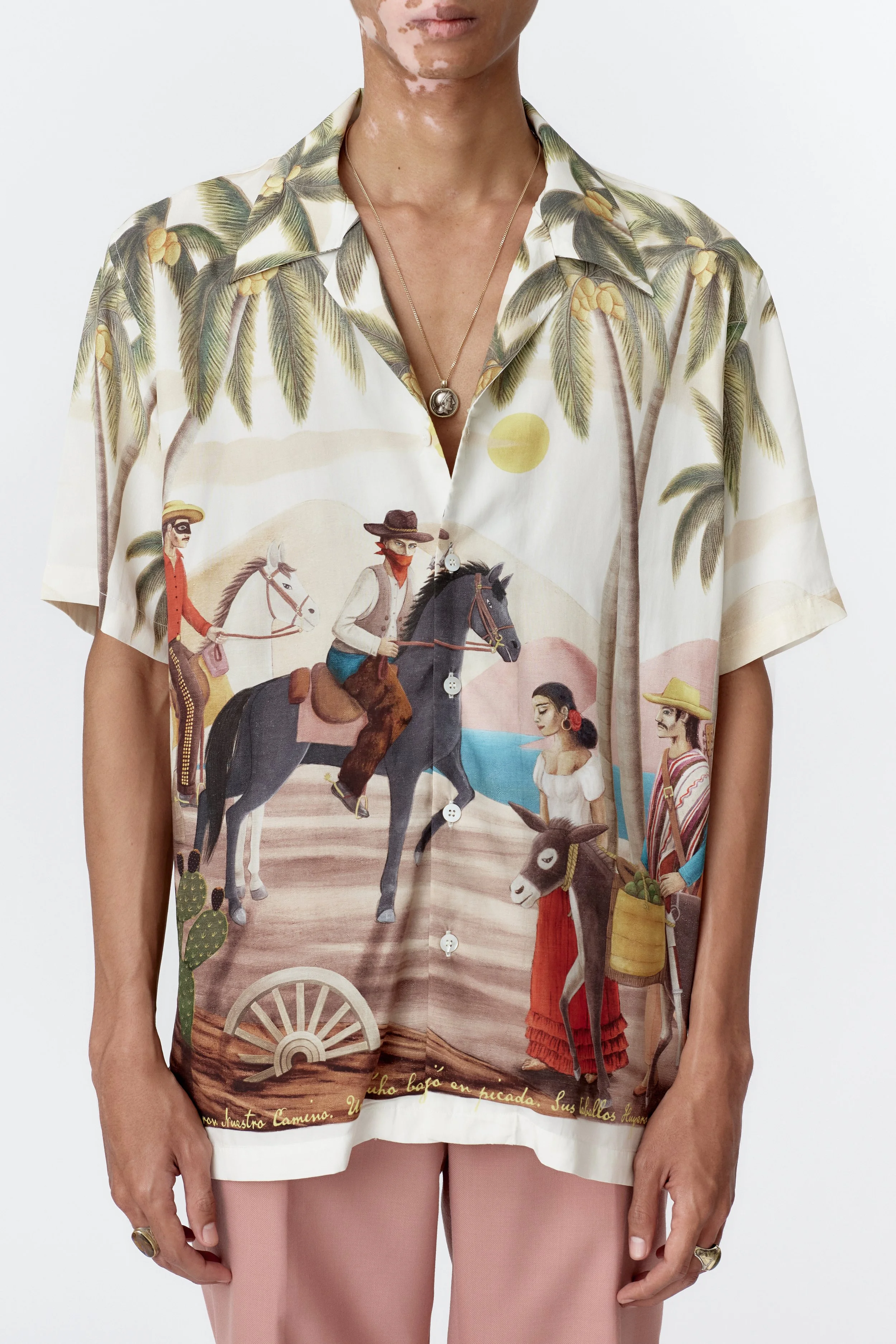 Close-up detail of modal fabric featuring farmer, donkey, and approaching cowboys painting