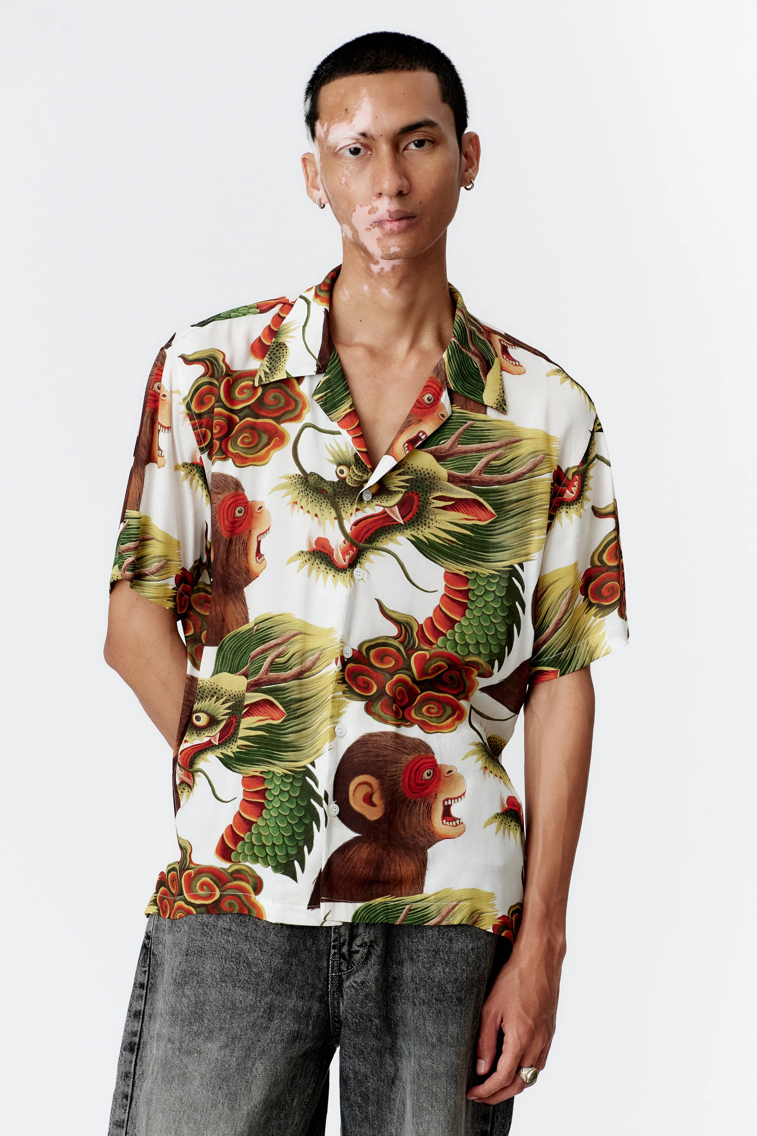 Camp collar and mother of pearl button detail on white crepe rayon shirt