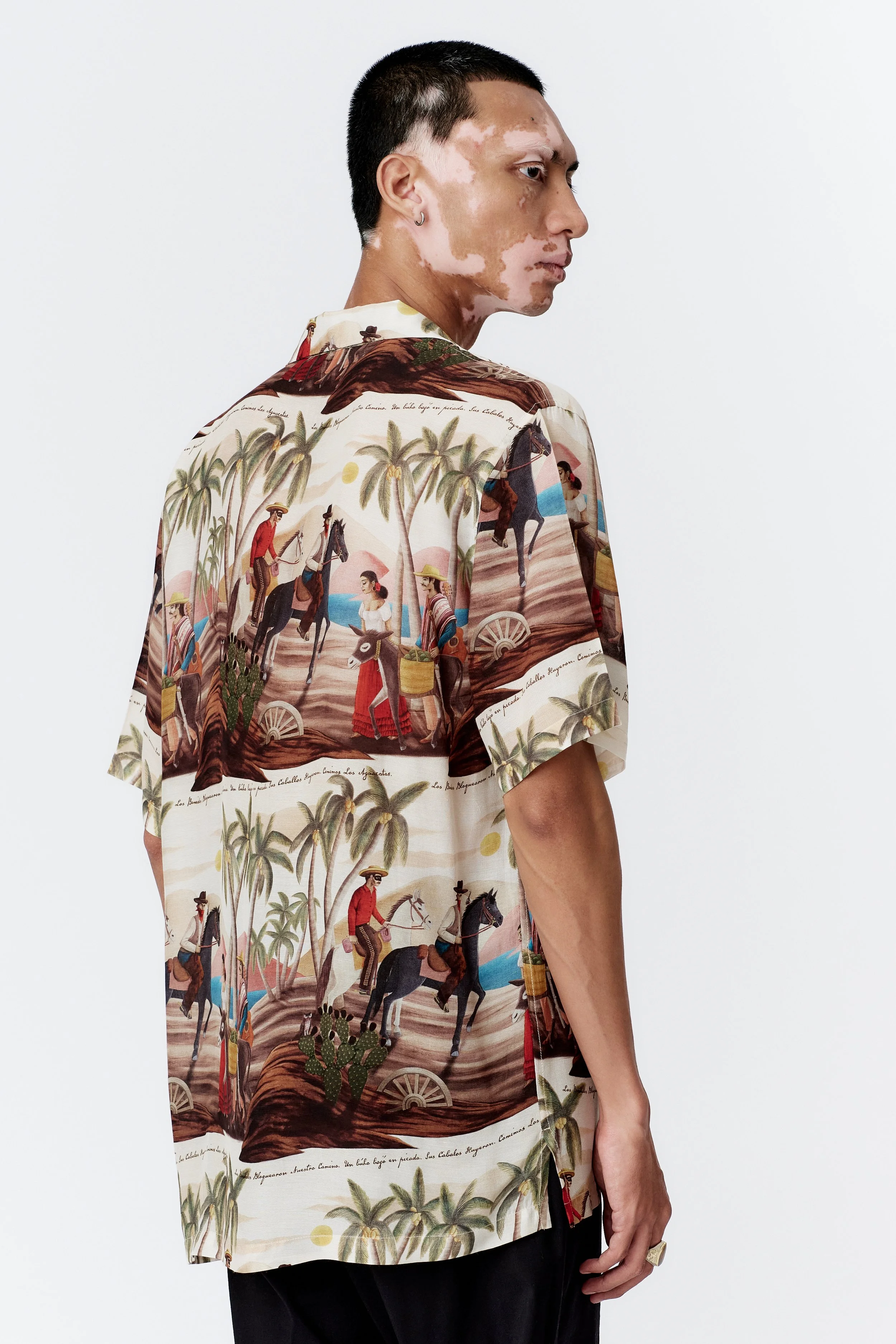 Back and Side profile of model wearing Bandito Repeat Off White camp collar shirt in lightweight silk rayon