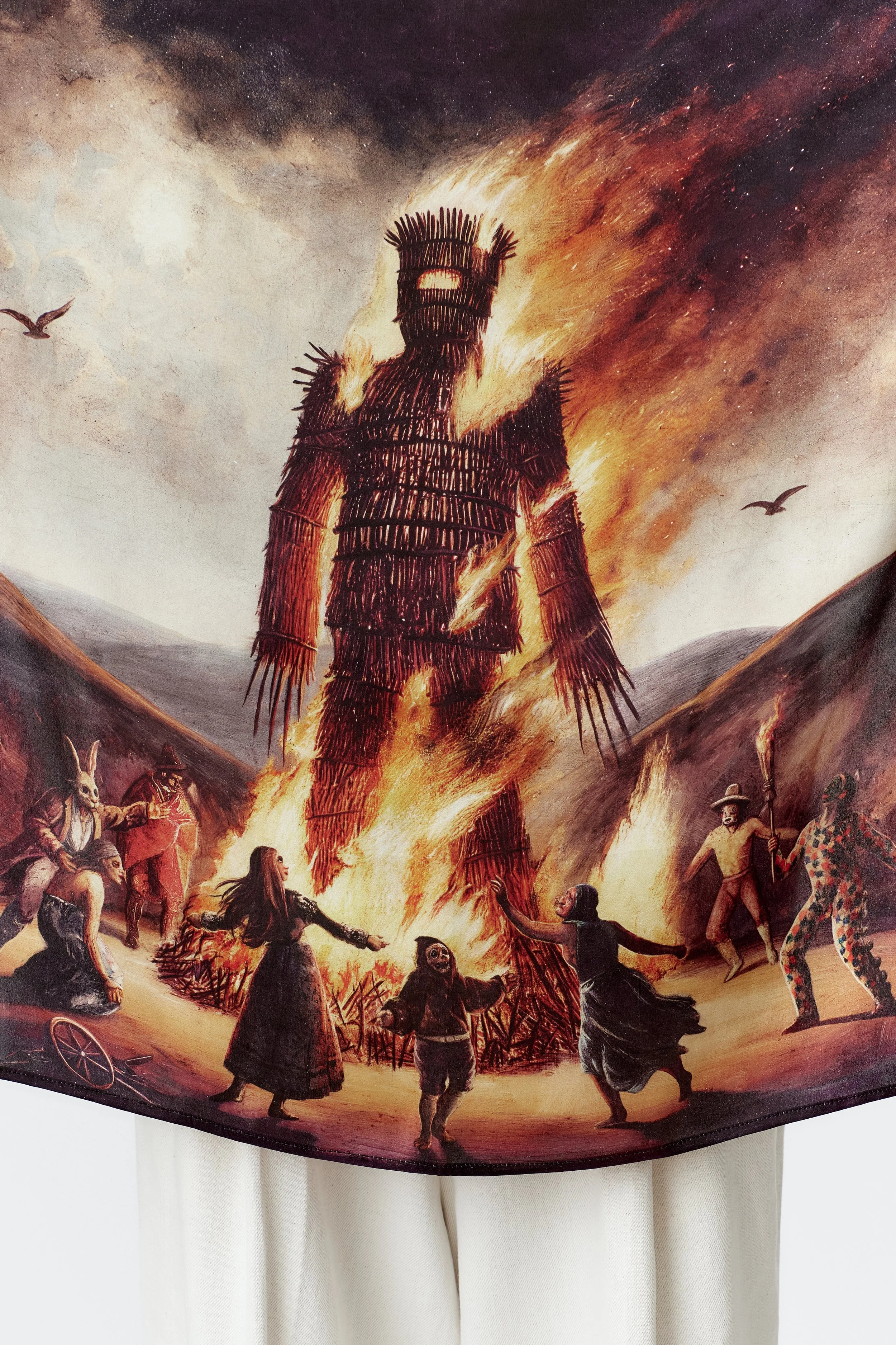 Close-up of Wickerman 100% silk scarf showing detailed illustration and satin sheen.