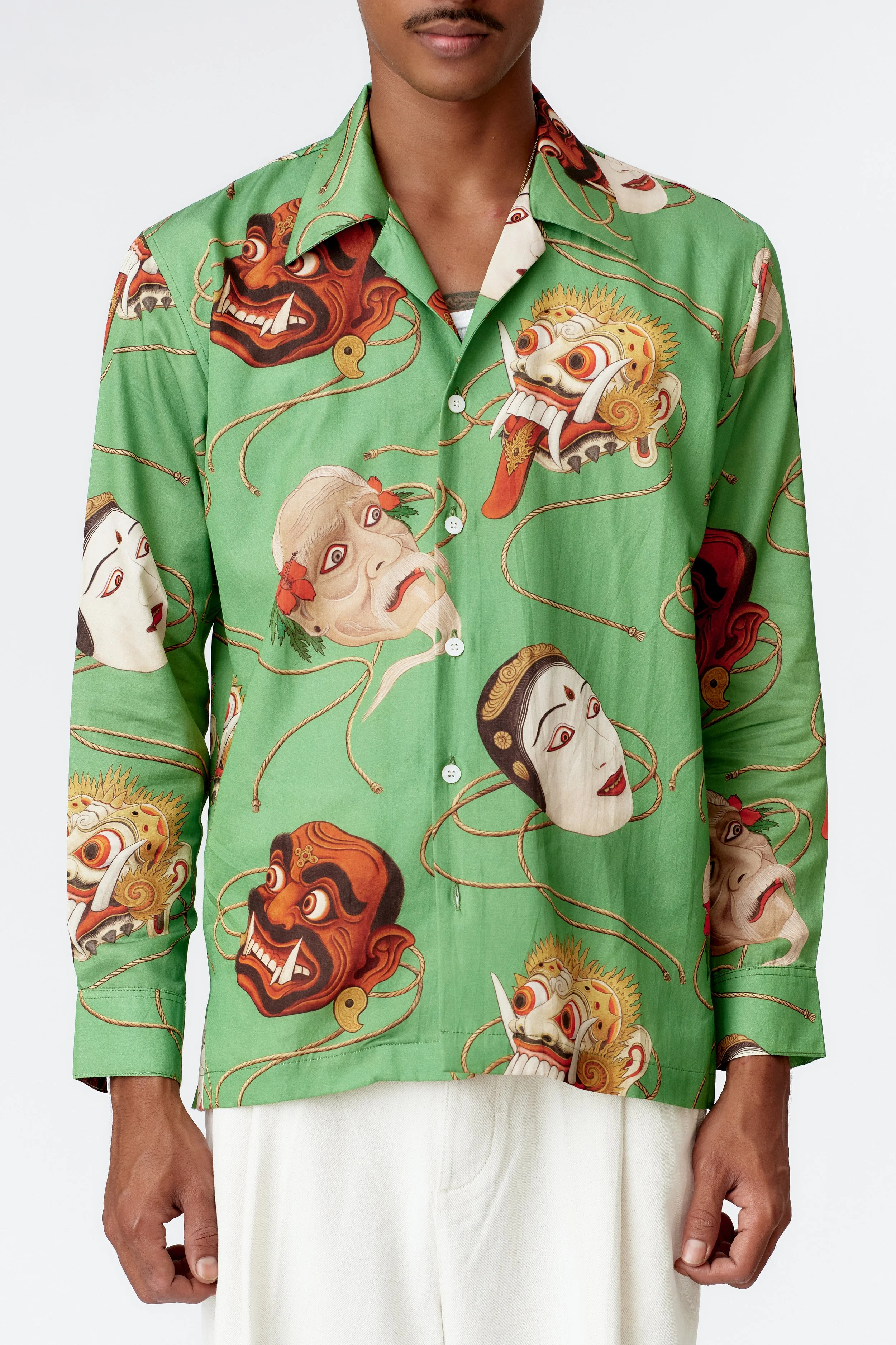 Detail of jade silk cotton fabric and Topeng mask artwork on limited edition shirt