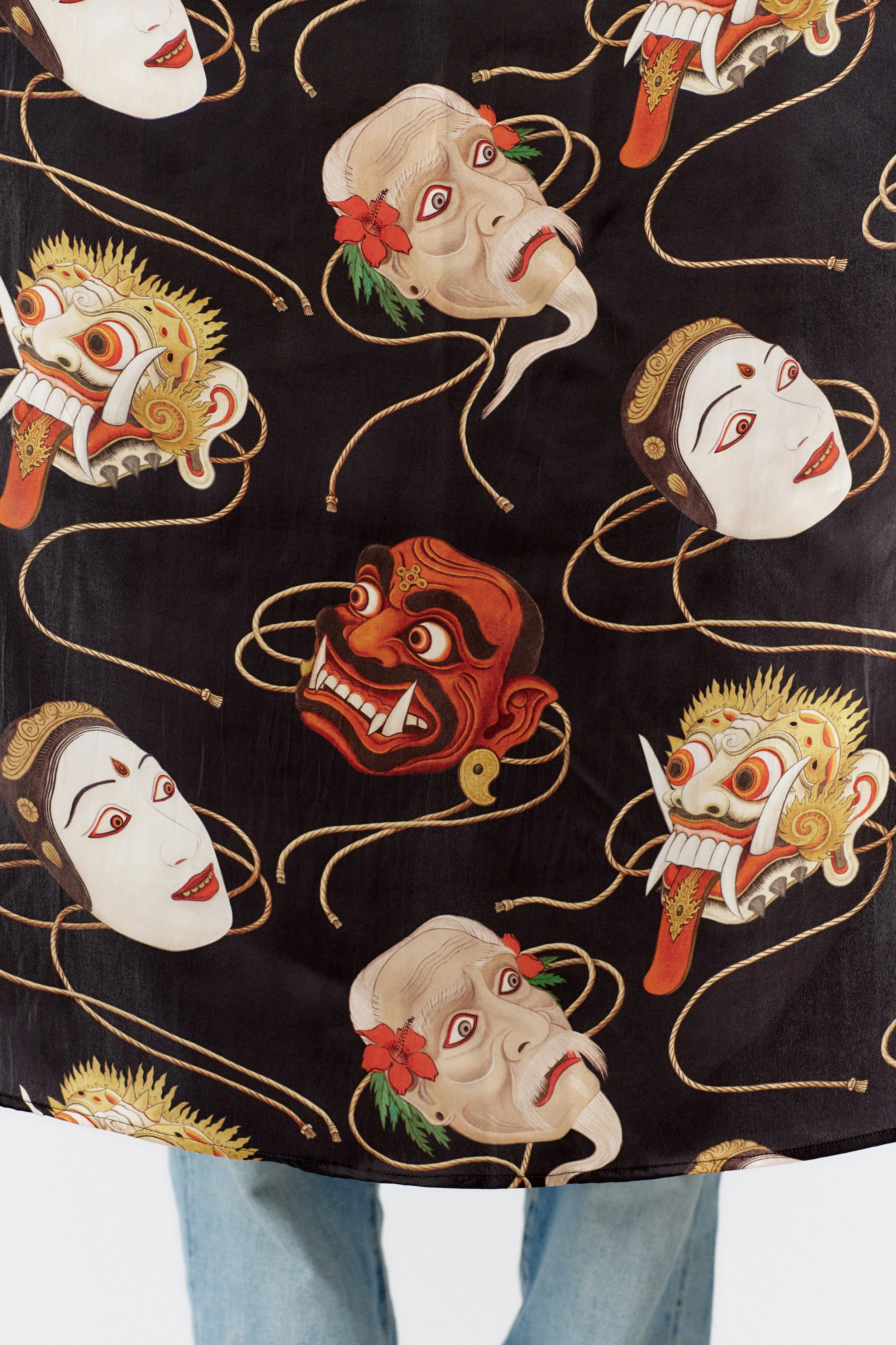 Vibrant multi-color Topeng silk scarf showcasing traditional Indonesian dance masks.