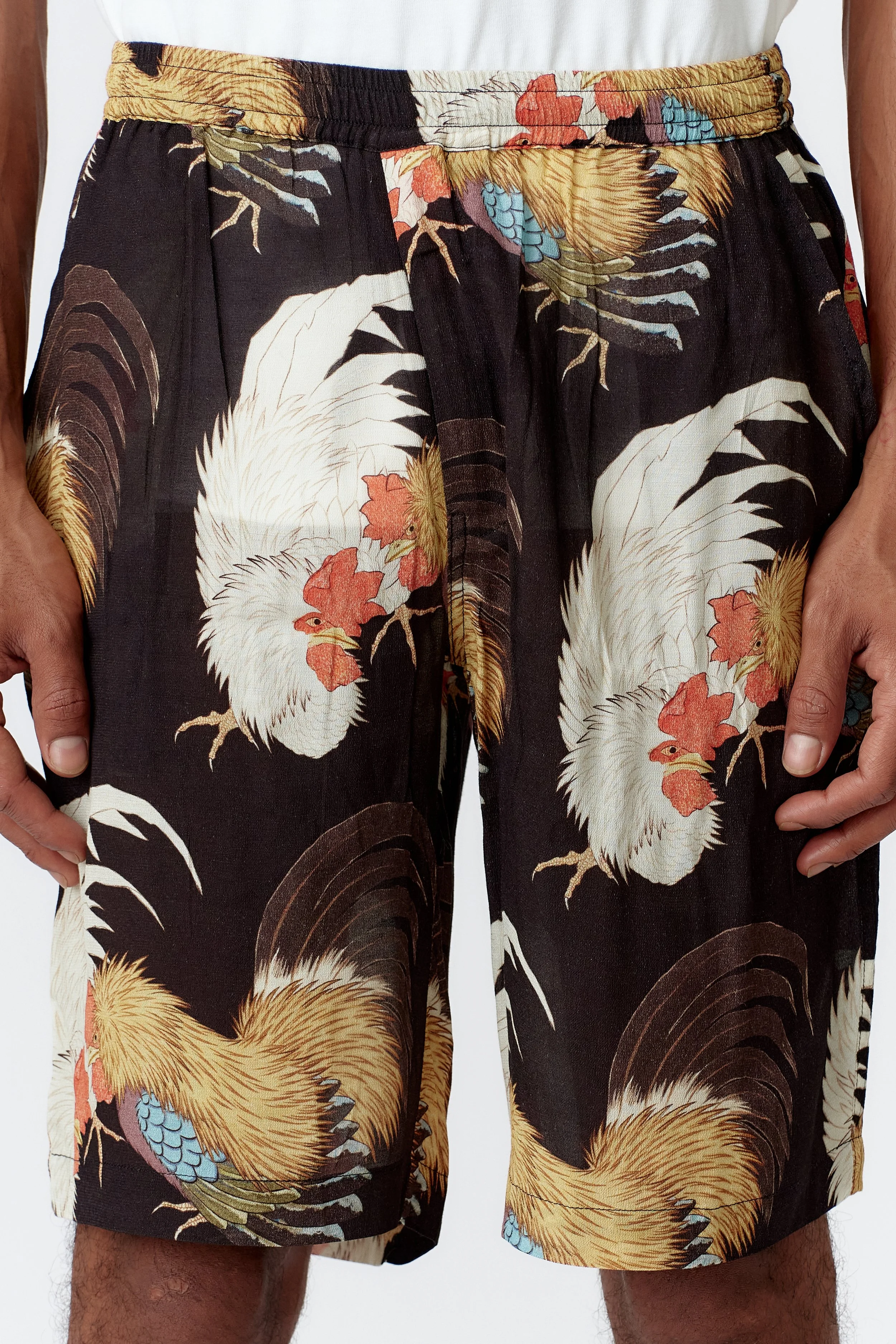 Close-up of rooster painting on endless joys rooster black board shorts made in crepe rayon