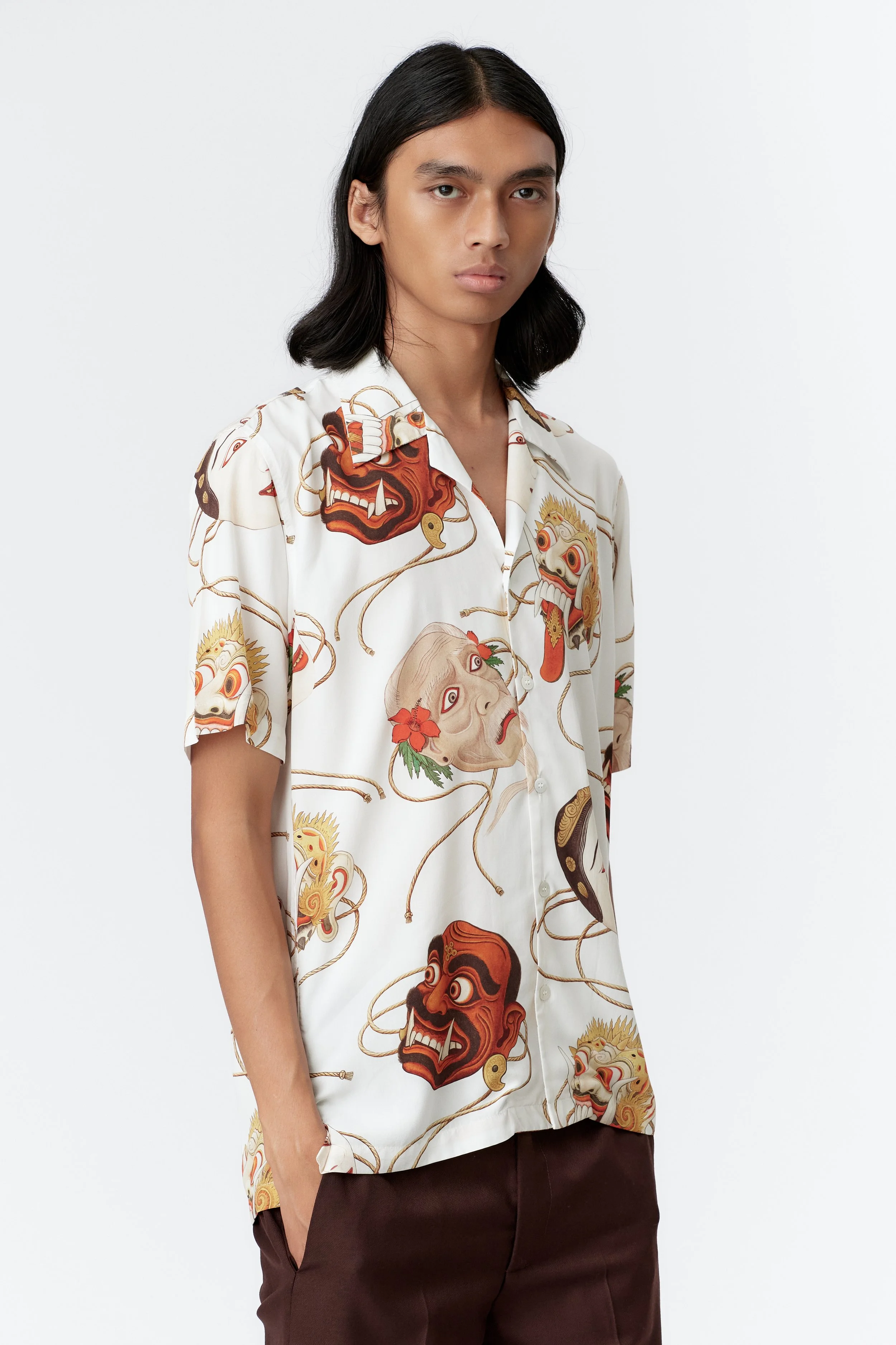 Topeng artwork close view of model premium fabric and mask painting by Stevie Anderson White shirt
