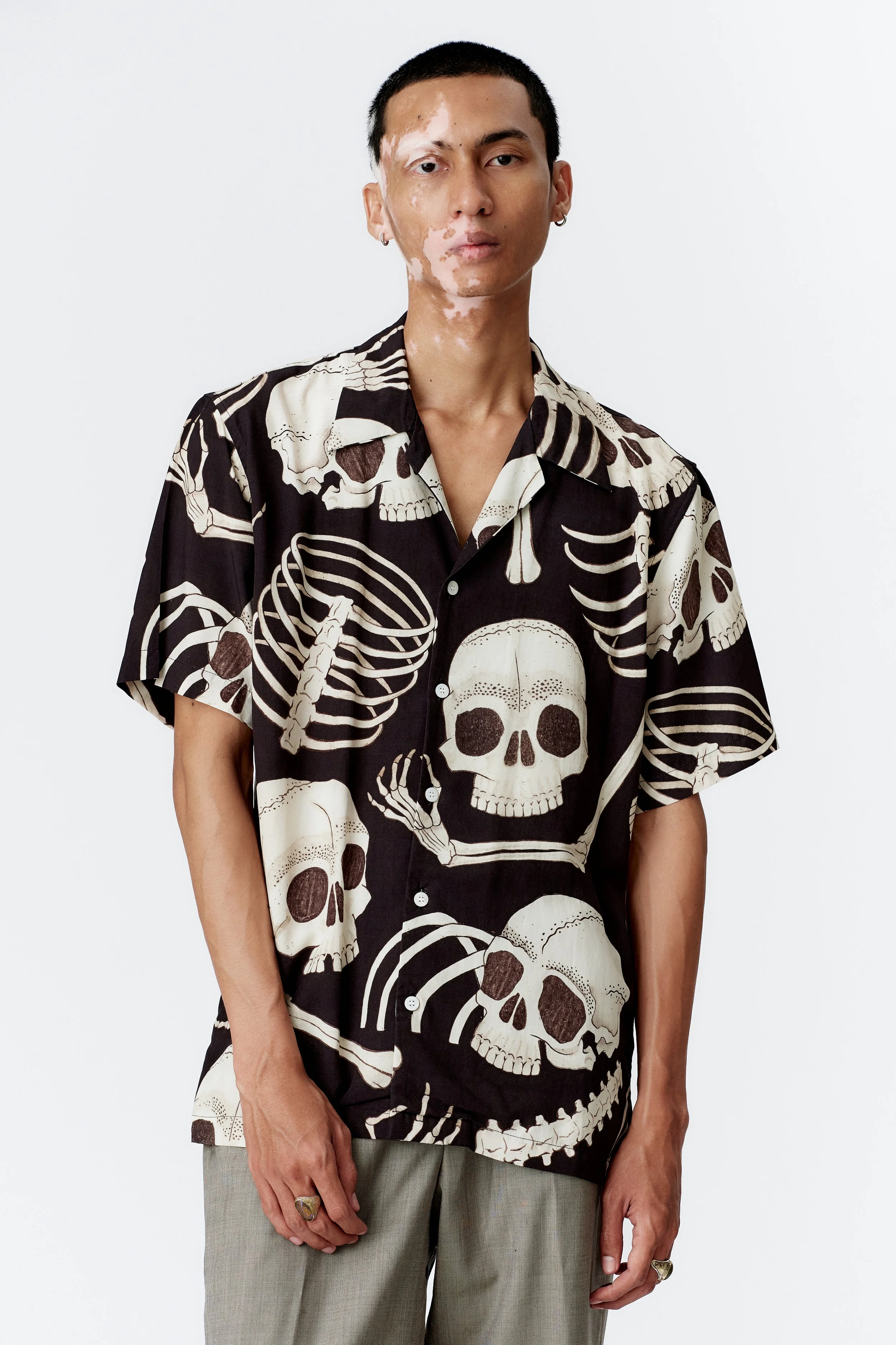 Three-quarter front view of Skeleton black camp collar shirt in lightweight modal