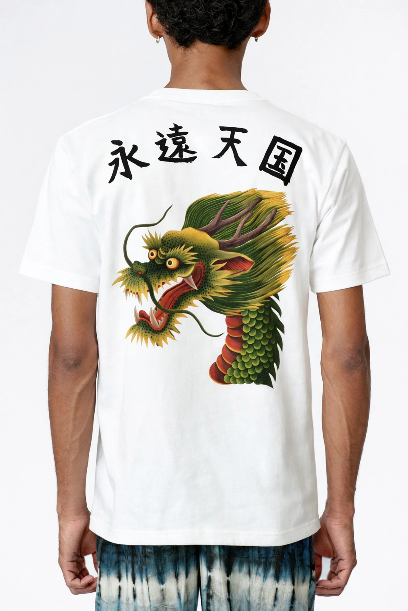 Rear view of model wearing Monkey Dragon back-print white heavyweight organic cotton T-shirt with Japanese hand-painted kanji