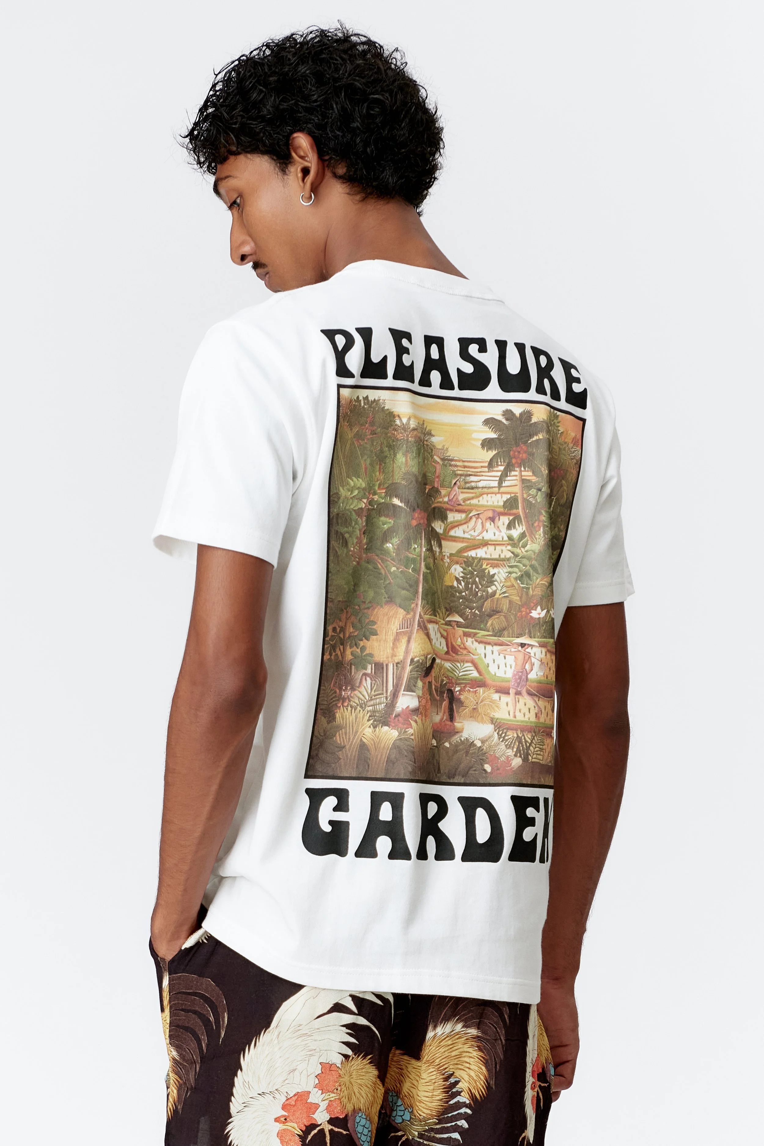 Back view of Pleasure Garden white T-shirt featuring vibrant Bali rice terrace artwork