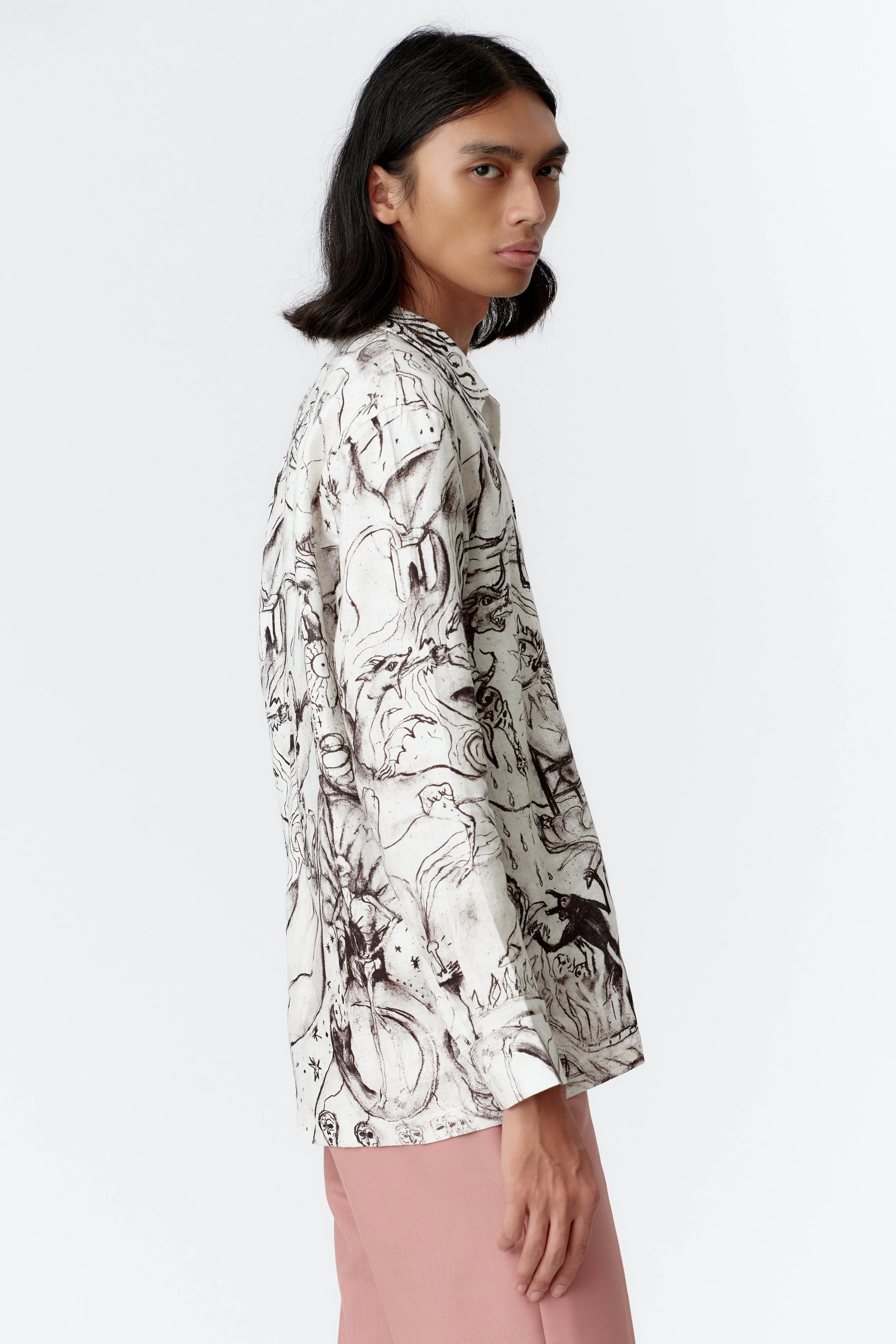 Side view of ALCHEMY linen long sleeve shirt highlighting continuation of surreal artwork