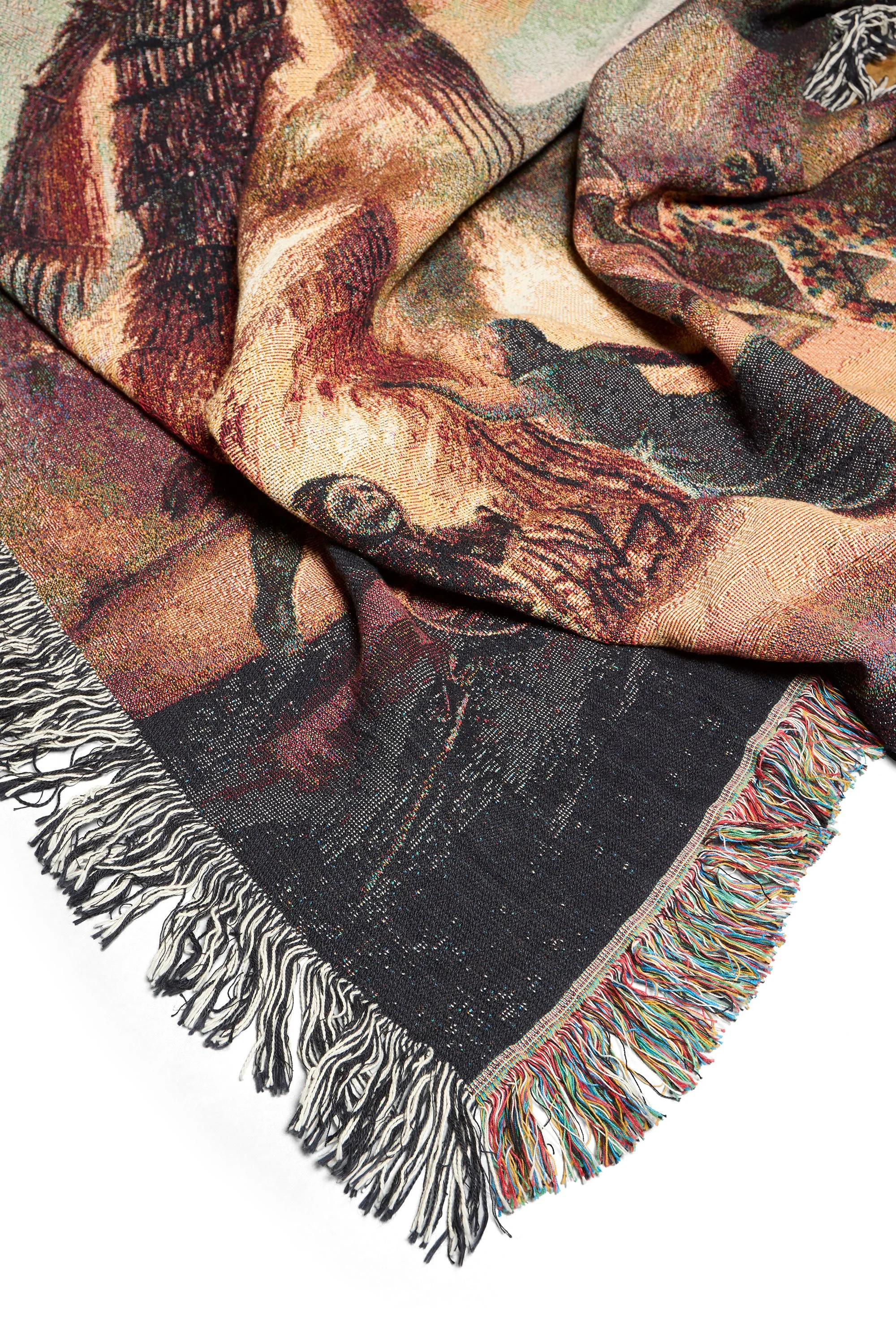 Fringed edge detail of Wickerman organic cotton woven blanket