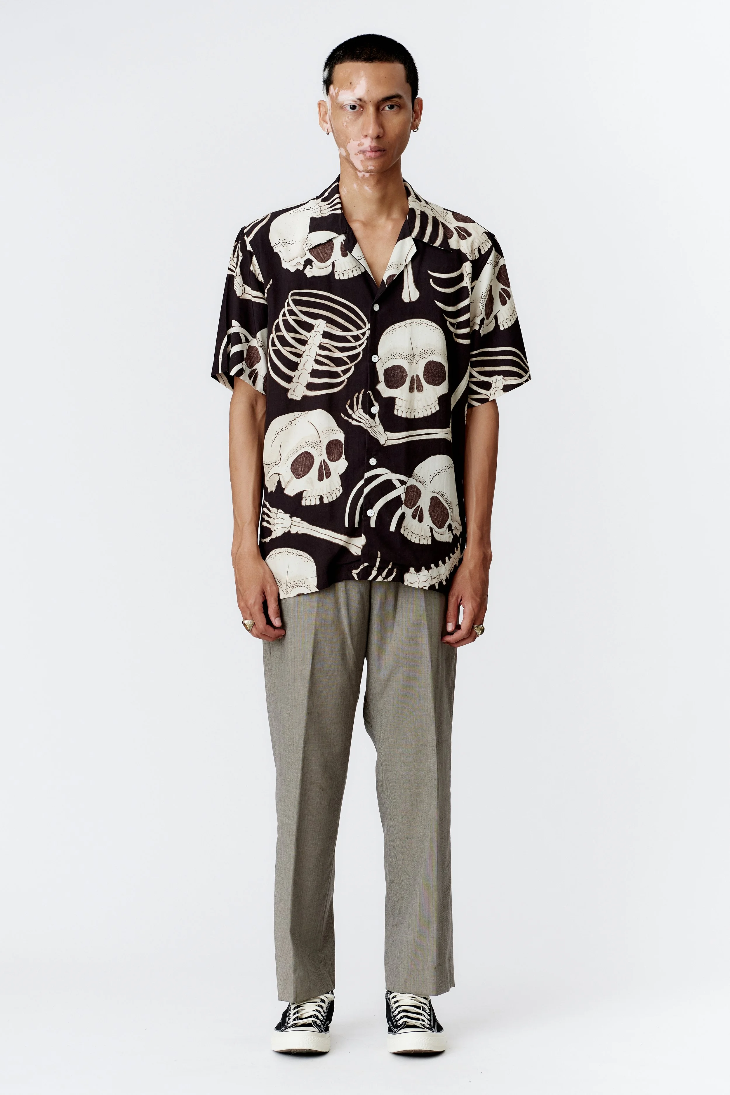 Full front view of Skeleton black 100% modal short sleeve shirt with bold skull and bone print