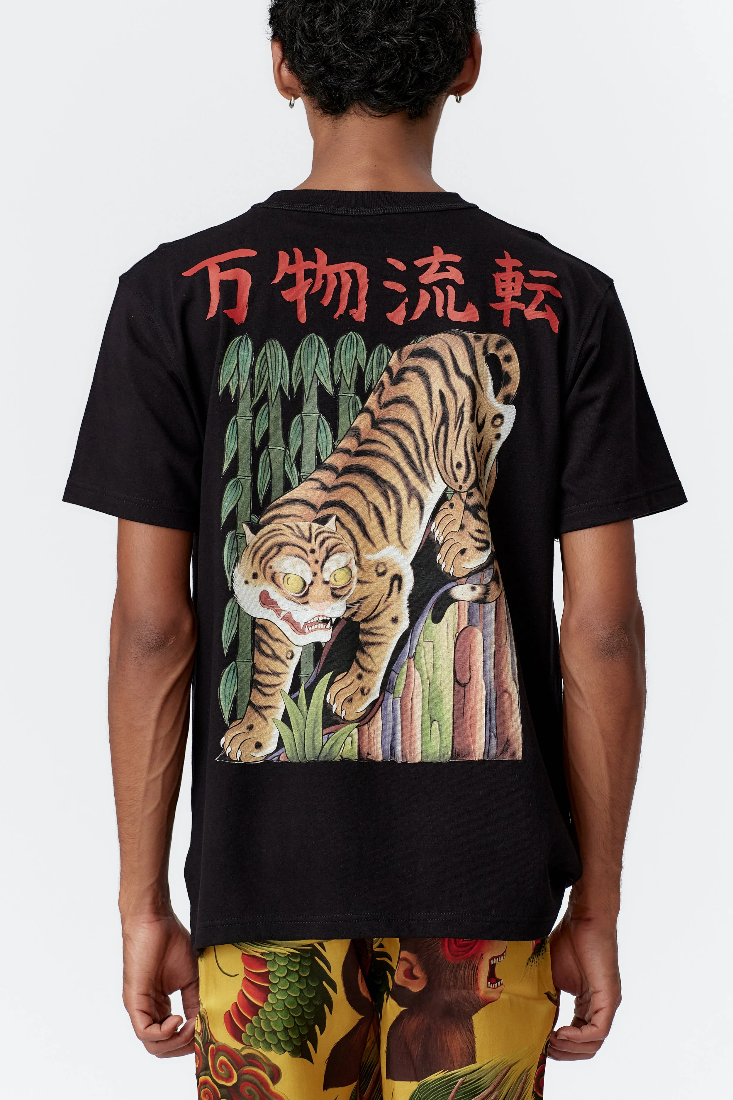 Close-up of prowling tiger illustration with bold stripes and sharp white claws