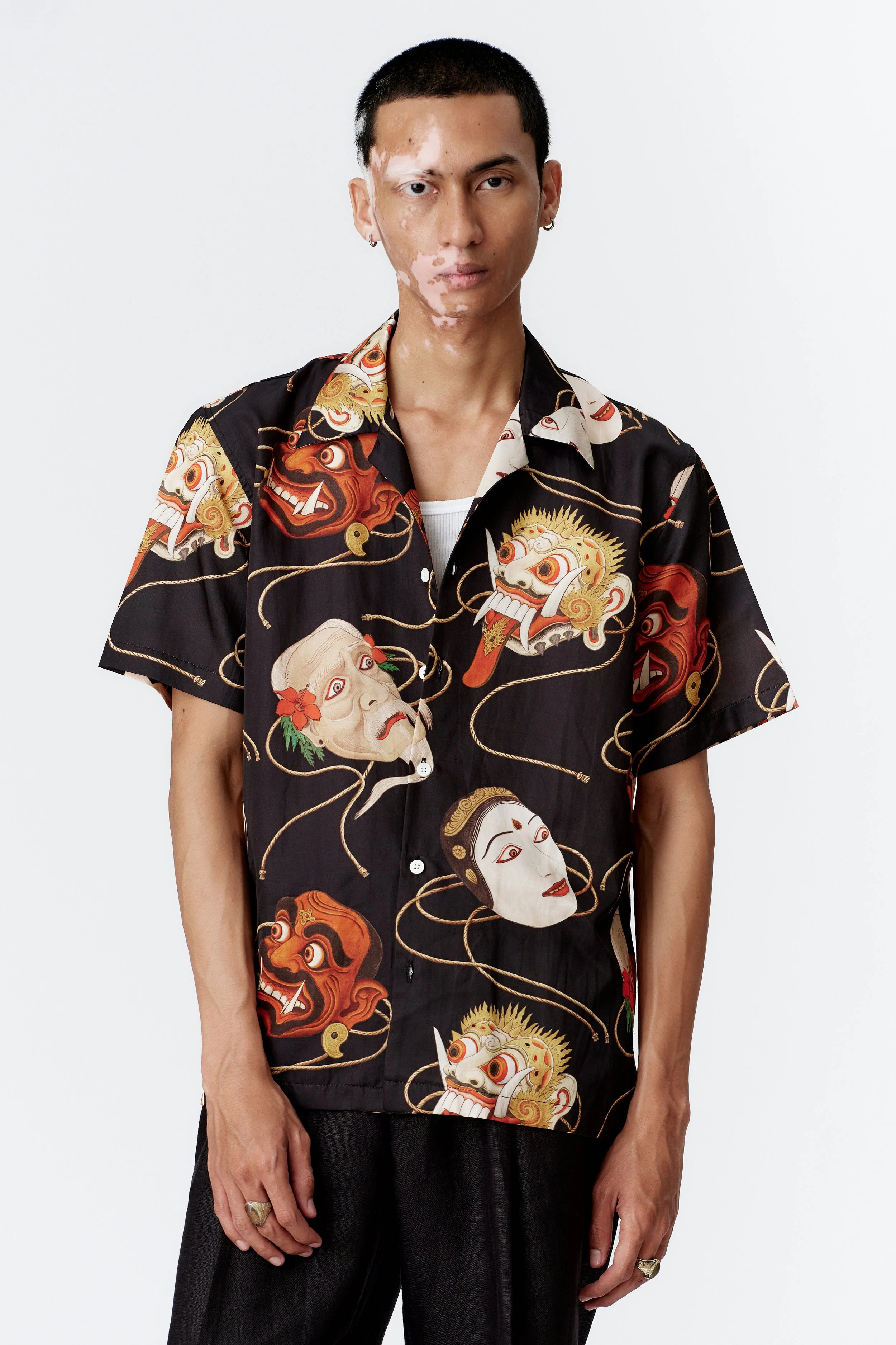 Model Dwika from Bali wearing SS26 Topeng Black short sleeve shirt