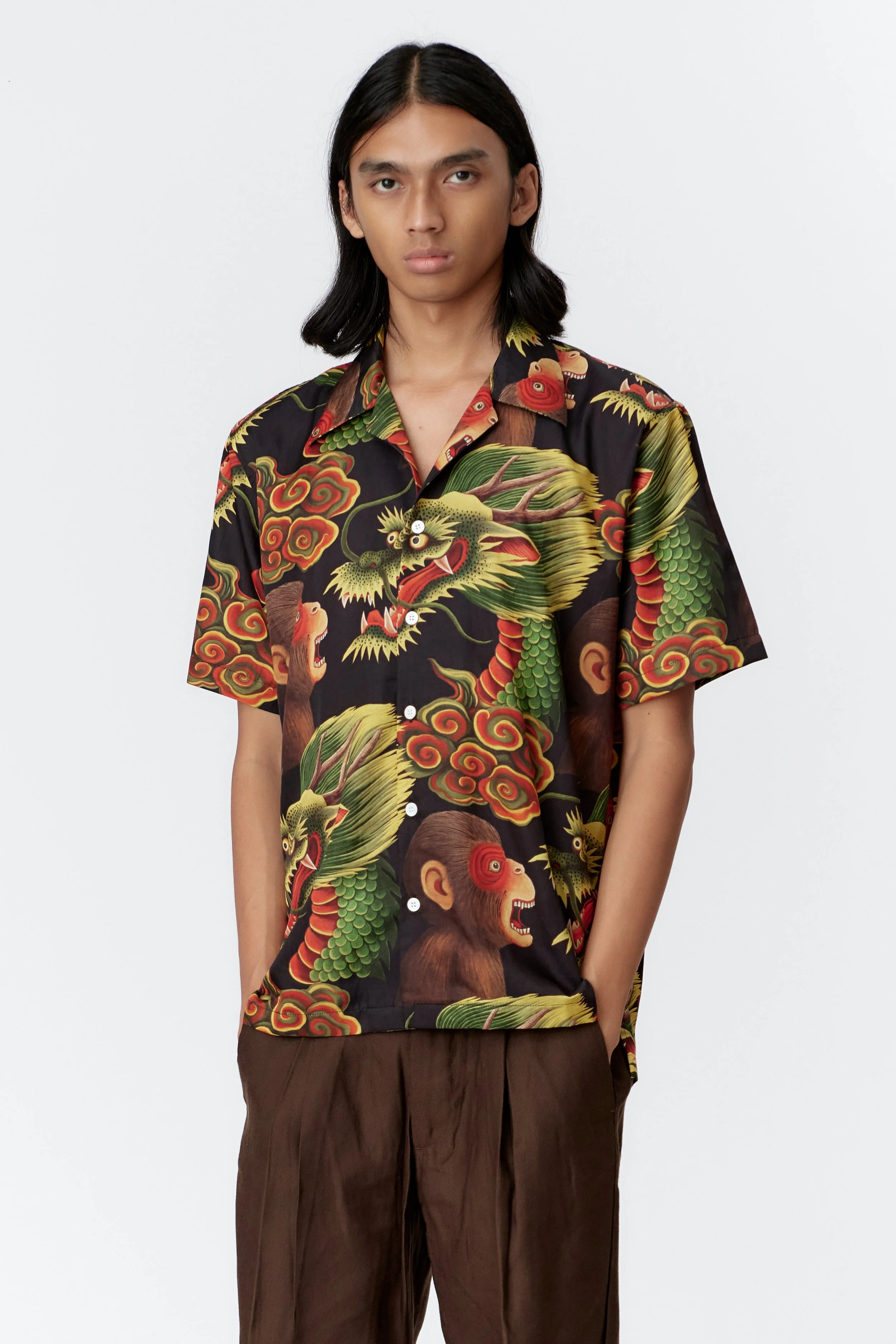 Camp collar and mother of pearl button detail on Monkey Dragon Black silk cotton shirt.