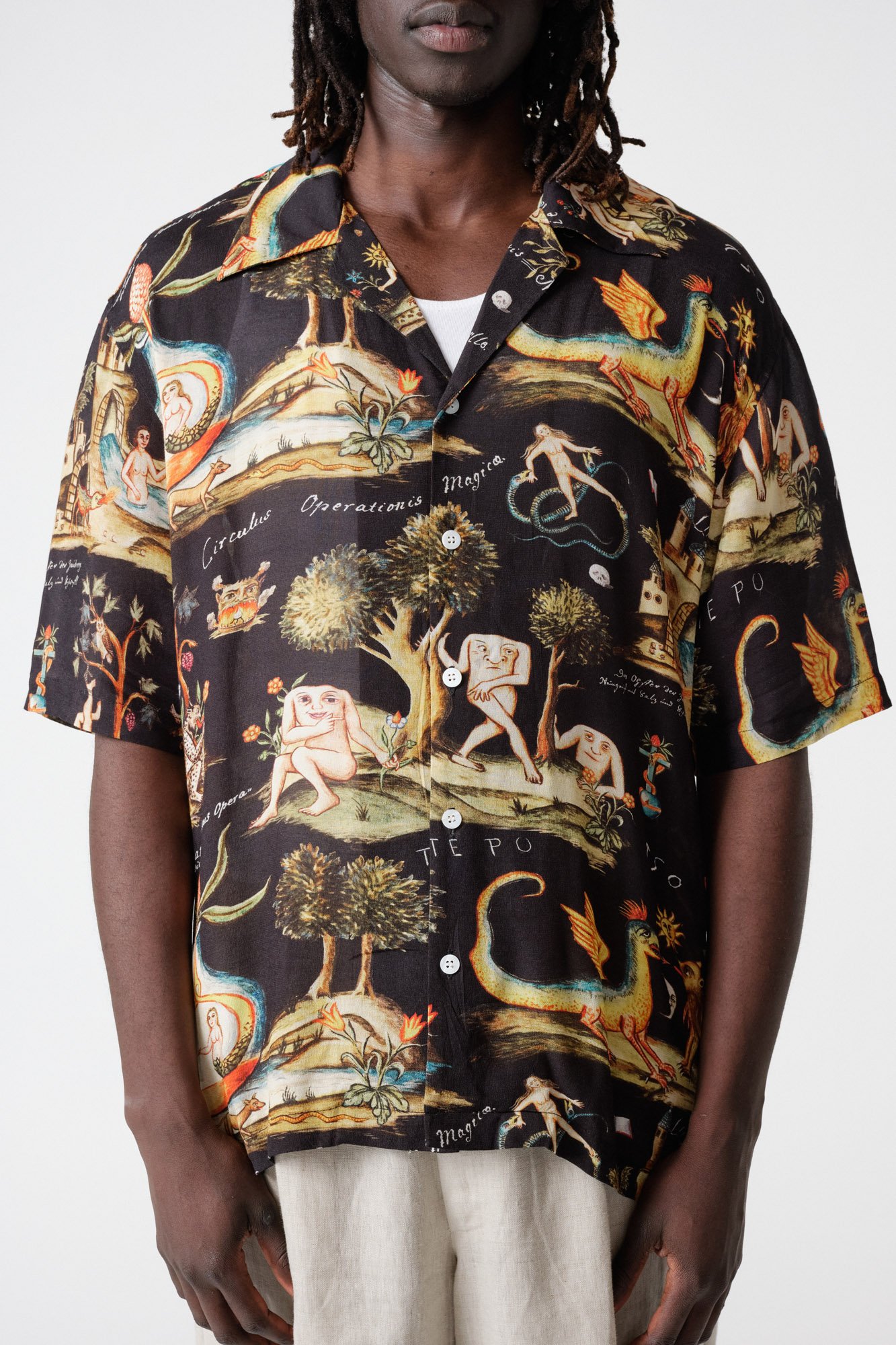 endless-joy-prima-materia-black-printed-crepe-rayon-short-sleeve-shirt-front-button-detail-close-up