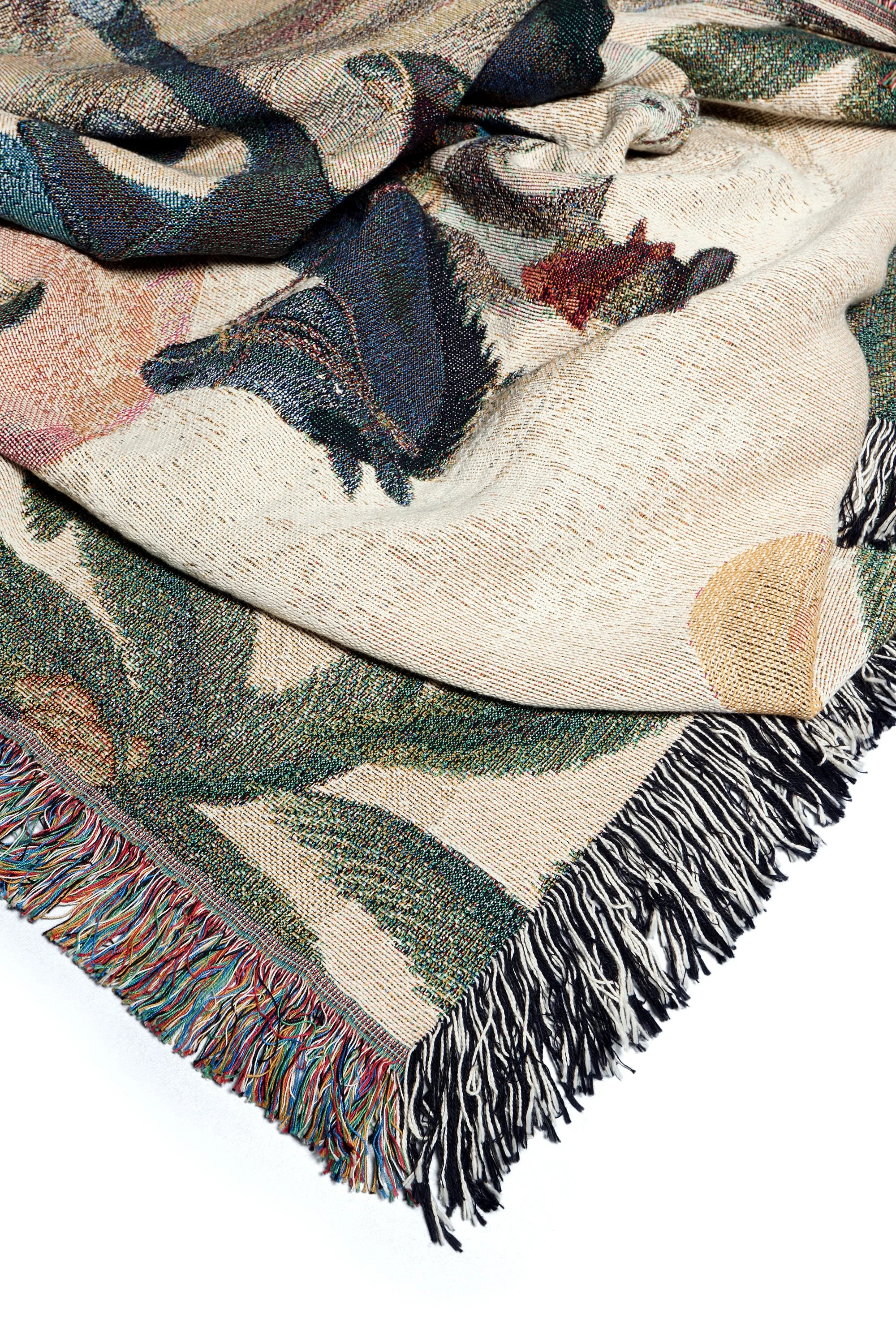 Detailed view of the fringed edge finish on the Bandito woven art blanket.