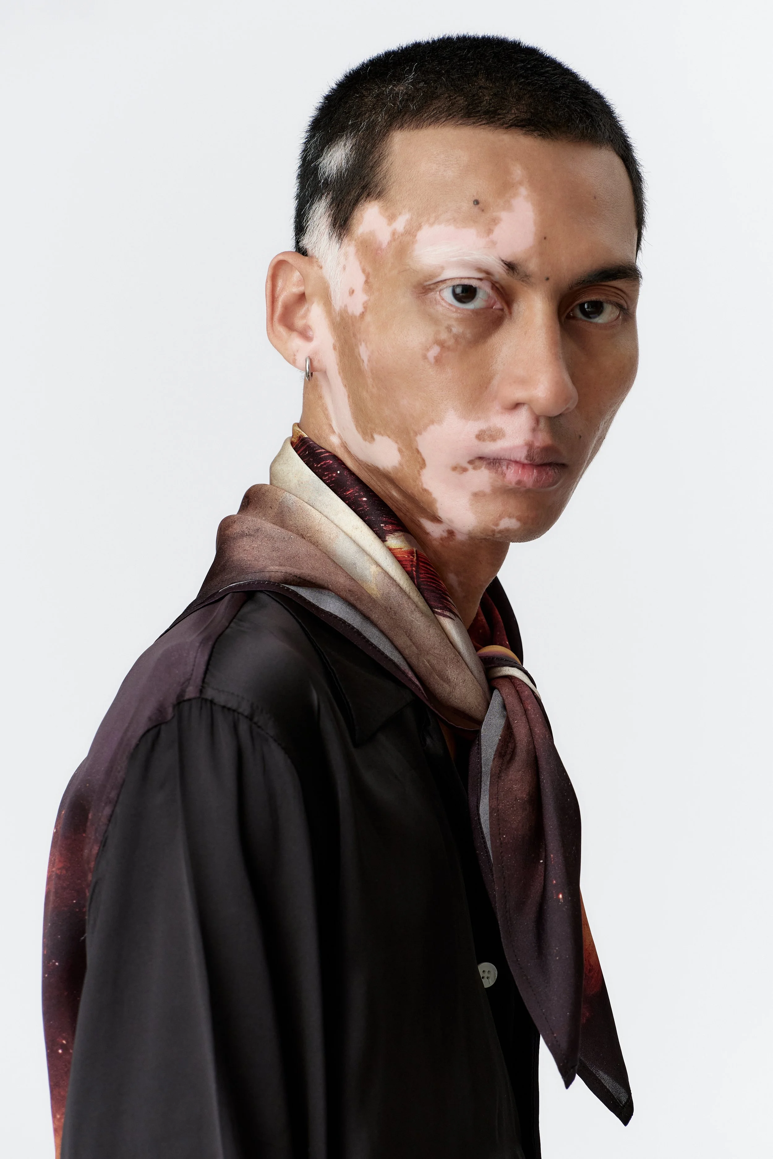 wickerman silk scarf tied around models neck