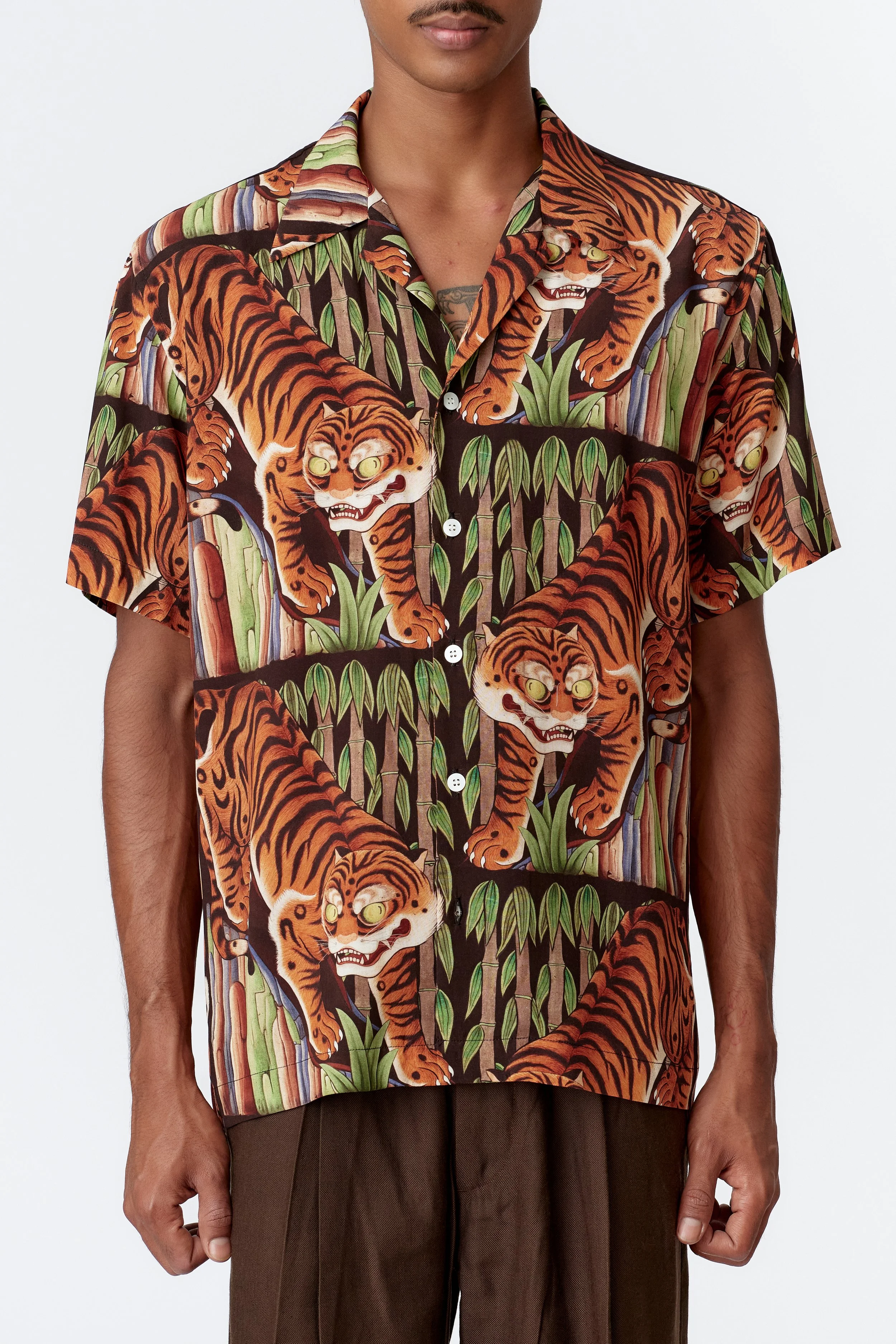 Close-up of camp collar and mother of pearl buttons on black rayon shirt