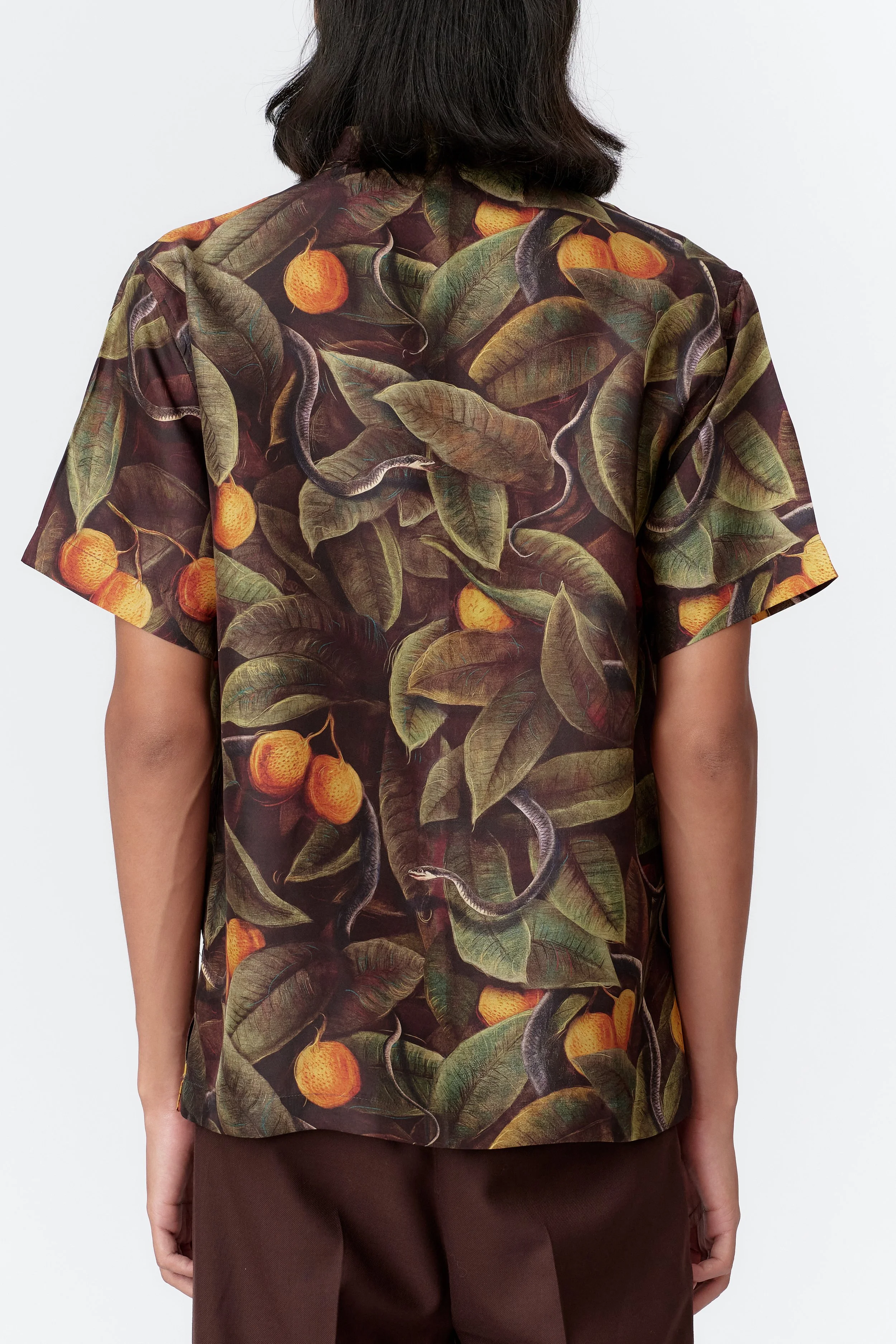 Rear close-up showing smooth silk satin fabric on back and sleeves, emphasizing contrast and craftsmanship