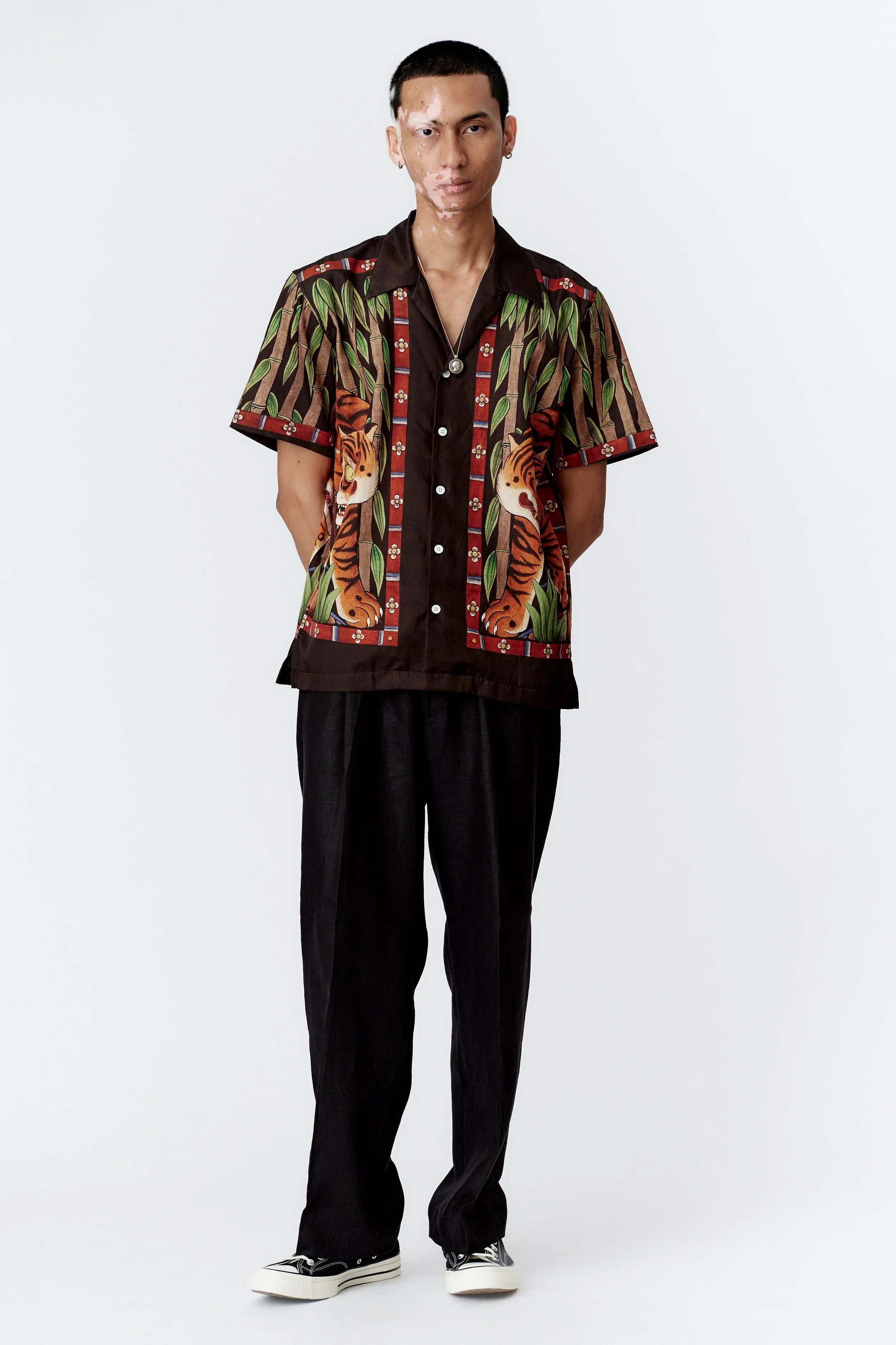 full view of model wearing bamboo tiger design artwork