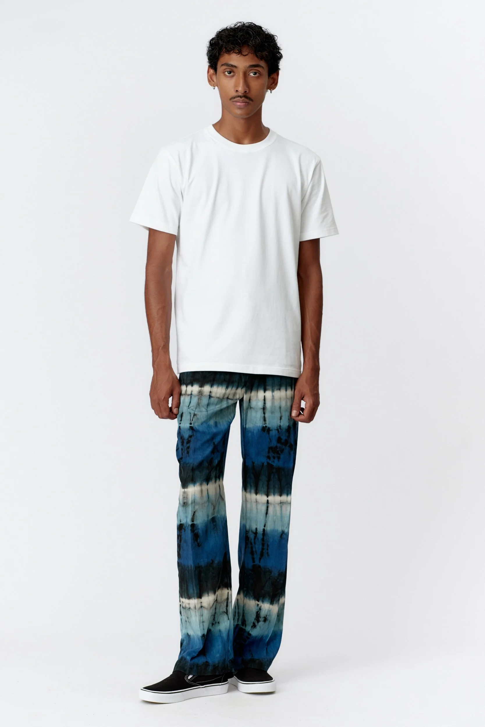 Full-length studio shot of model wearing Monkey Dragon back-print heavyweight organic cotton T-shirt in white with relaxed fit