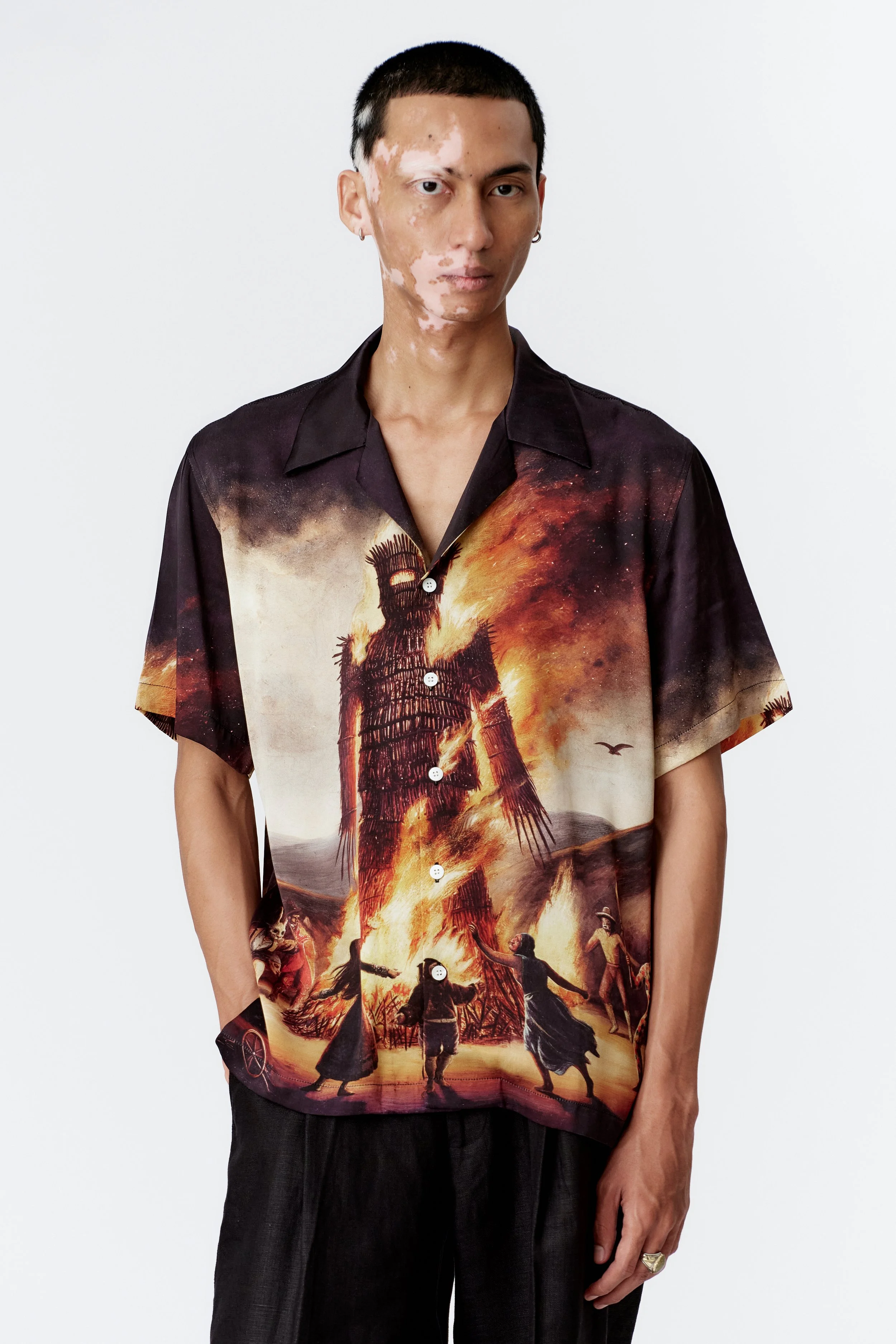 Detail of 100% silk satin fabric featuring Wickerman artwork in rich tonal depth