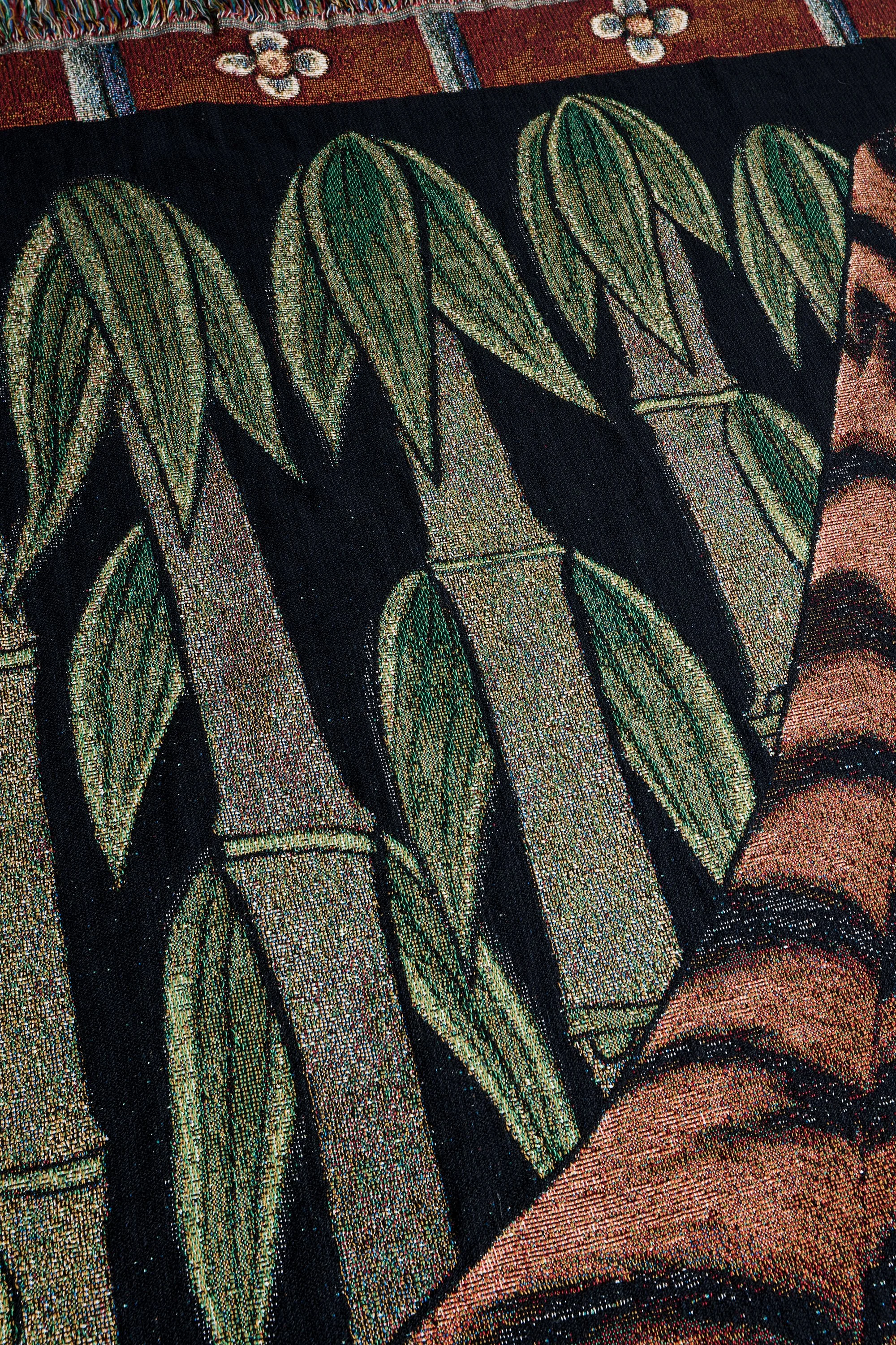 Green bamboo leaves detail from Tiger Bamboo woven art blanket
