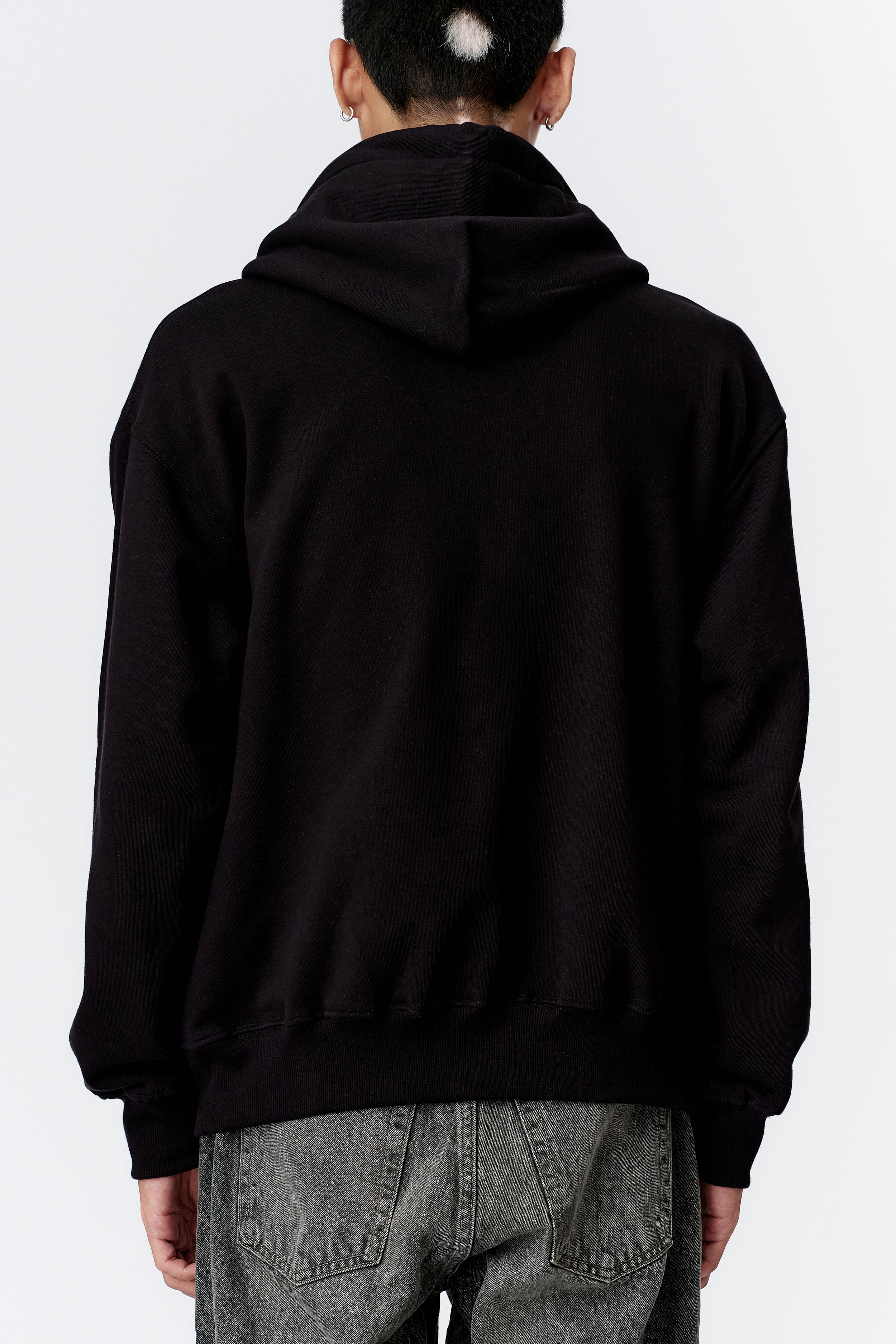 Fabric texture close-up of back black 100% heavyweight organic cotton hoodie