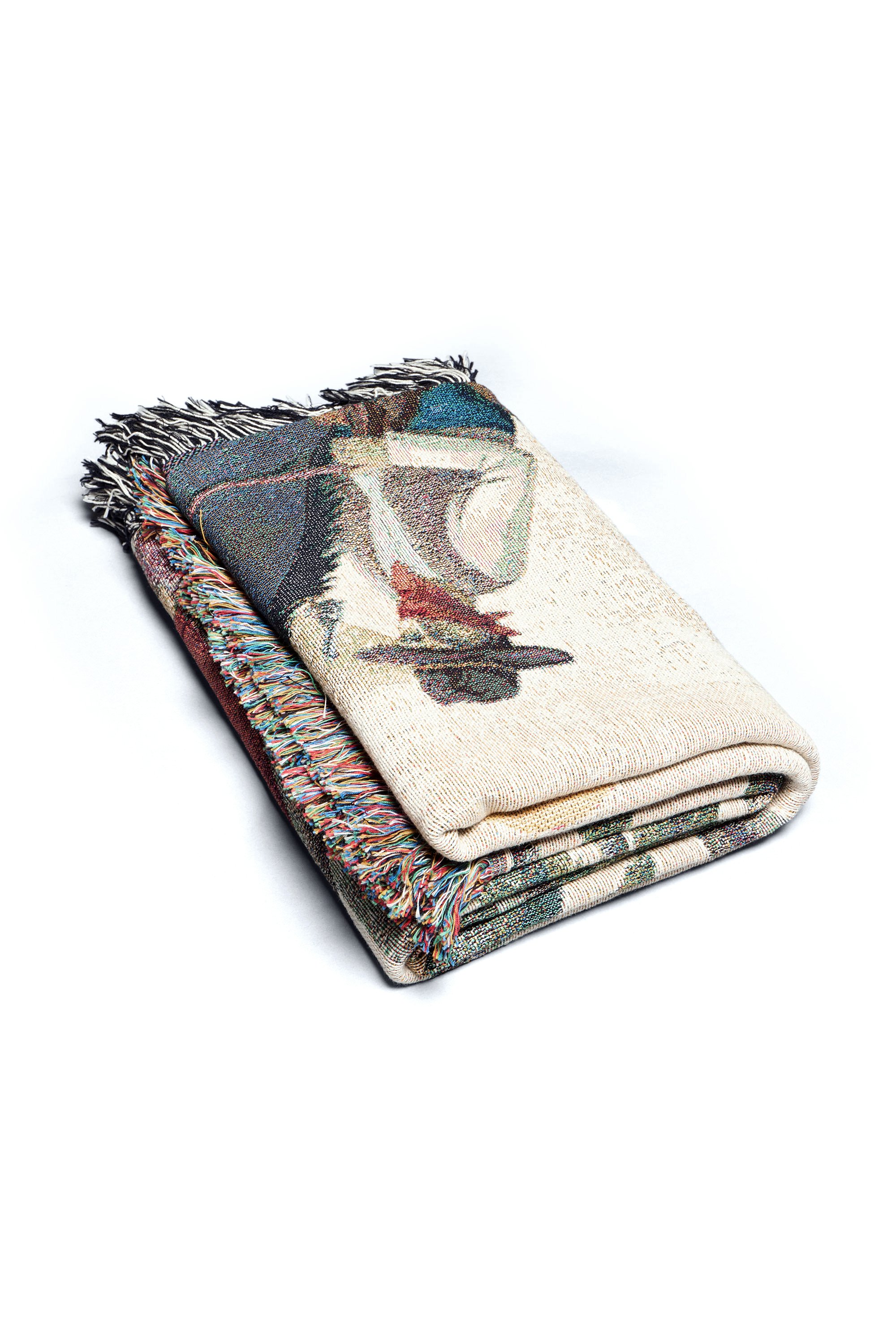 Folded flat image of the Bandito limited edition woven blanket crafted from 100% organic cotton.