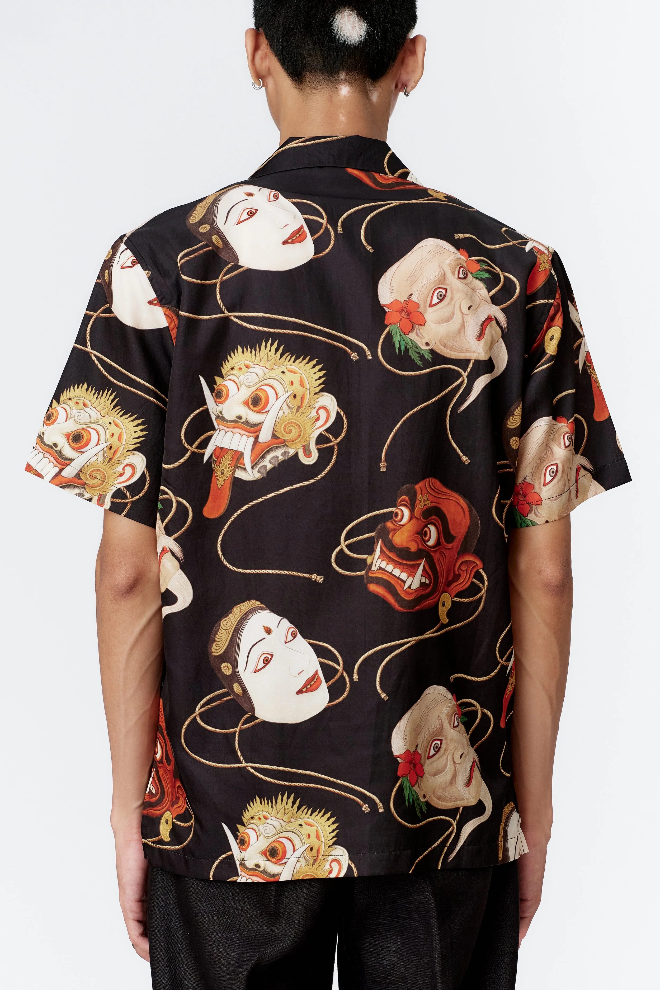 Model wearing SS26 Topeng Black short sleeve shirt back view