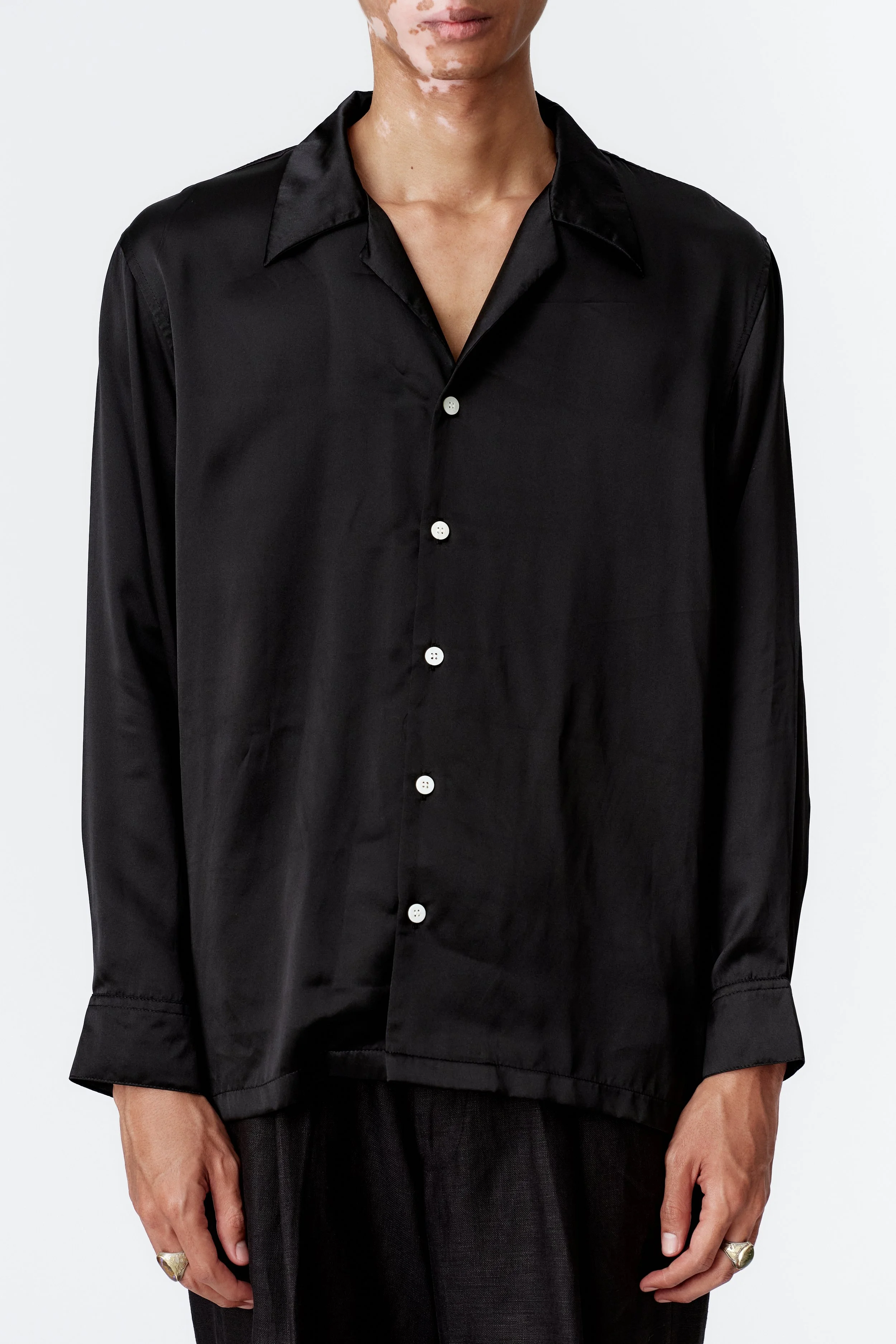 Wickerman silk satin close up of silk satin black shirt and mother of pearl buttons artwork on the back
